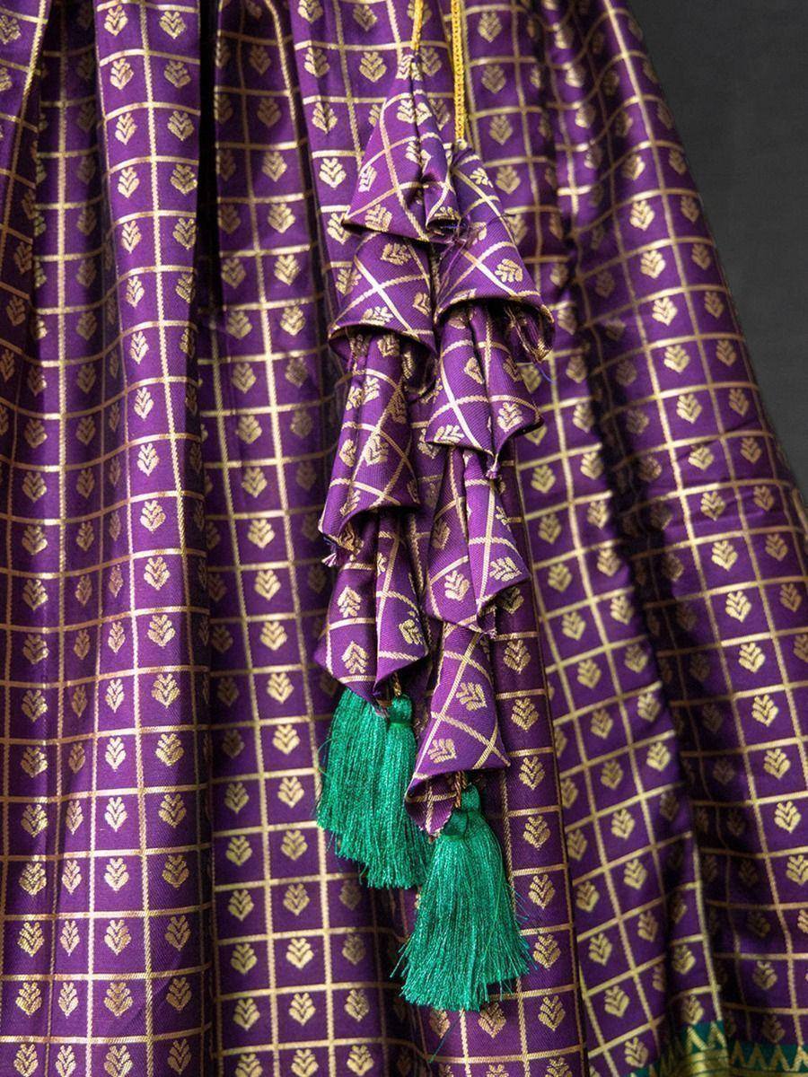 Purple ethnic lehenga with gold checks, ruffles & green tassels, designer Indian wear