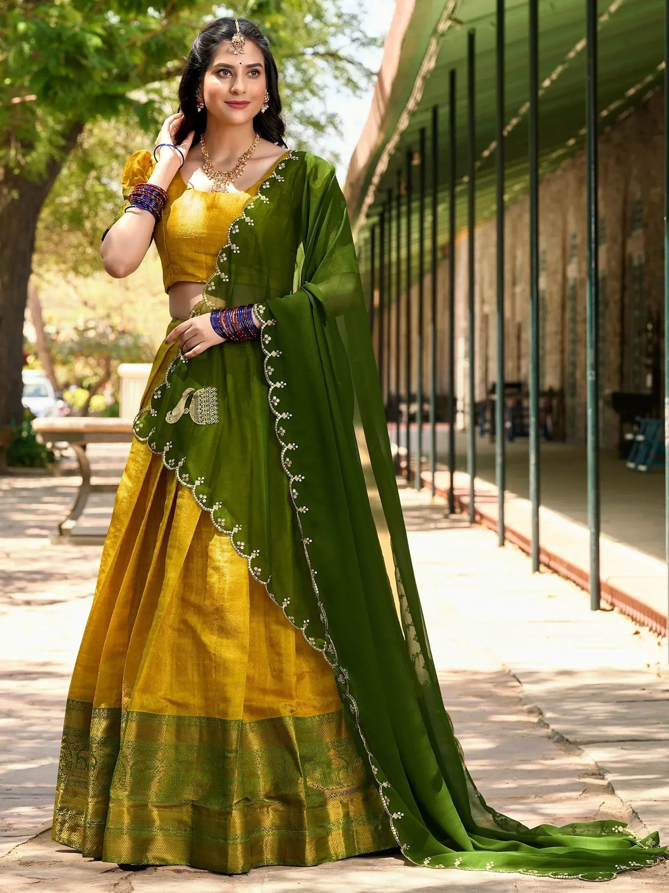 Green and gold designer lehenga choli with embroidered dupatta, perfect for Indian ethnic occasions