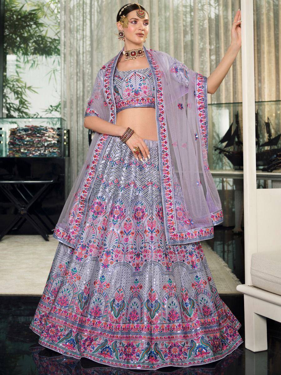 Lavish lavender lehenga choli with floral embroidery, perfect for Indian weddings and festive occasions.