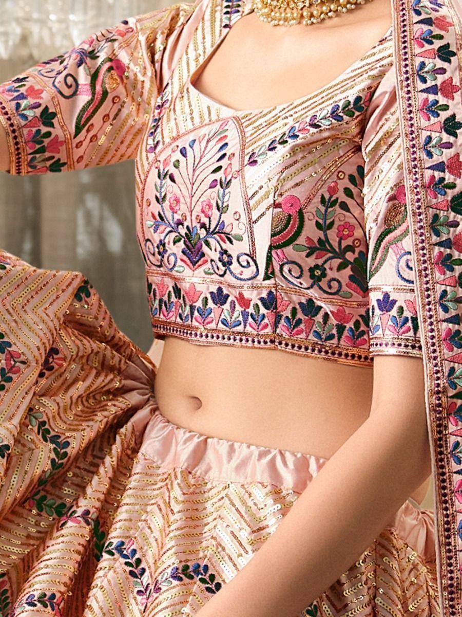 Pink embroidered lehenga choli with floral and peacock motifs, perfect for Indian ethnic wear