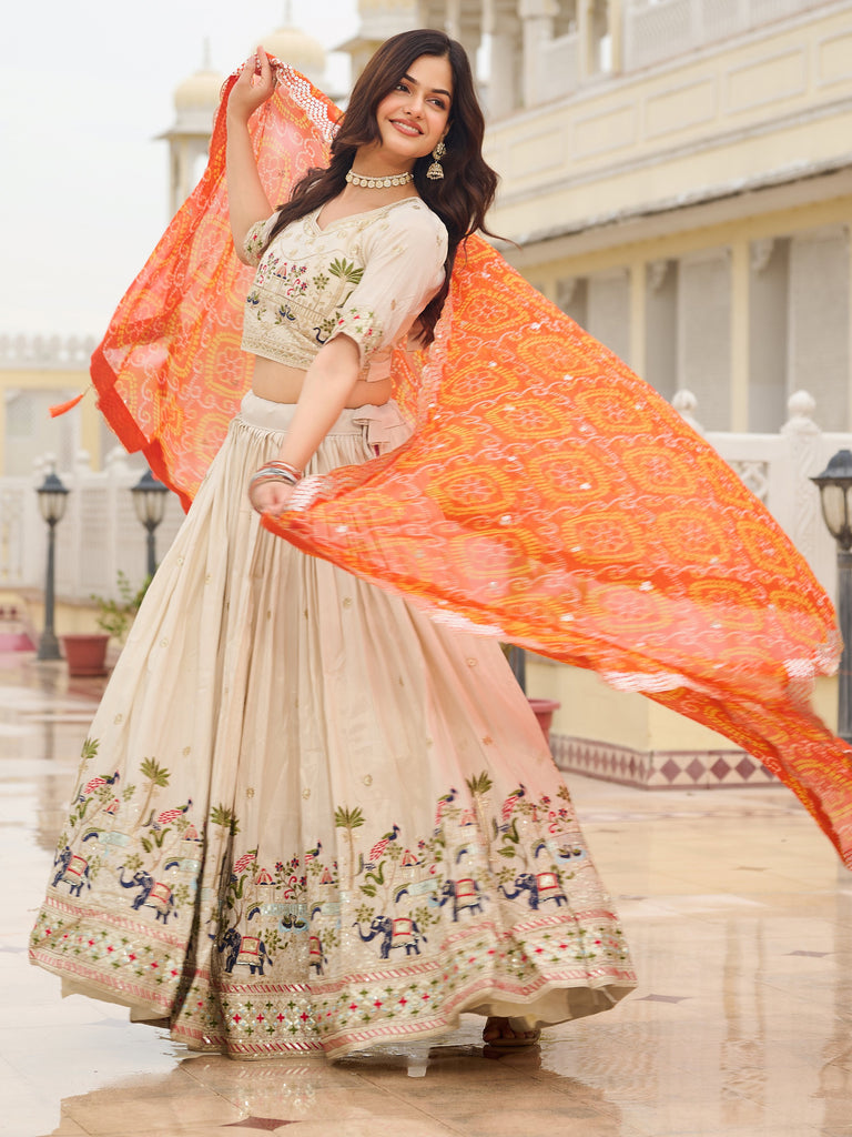 Majestic Off-White Sequnis Silk Lehenga Choli With Orange Dupatta 