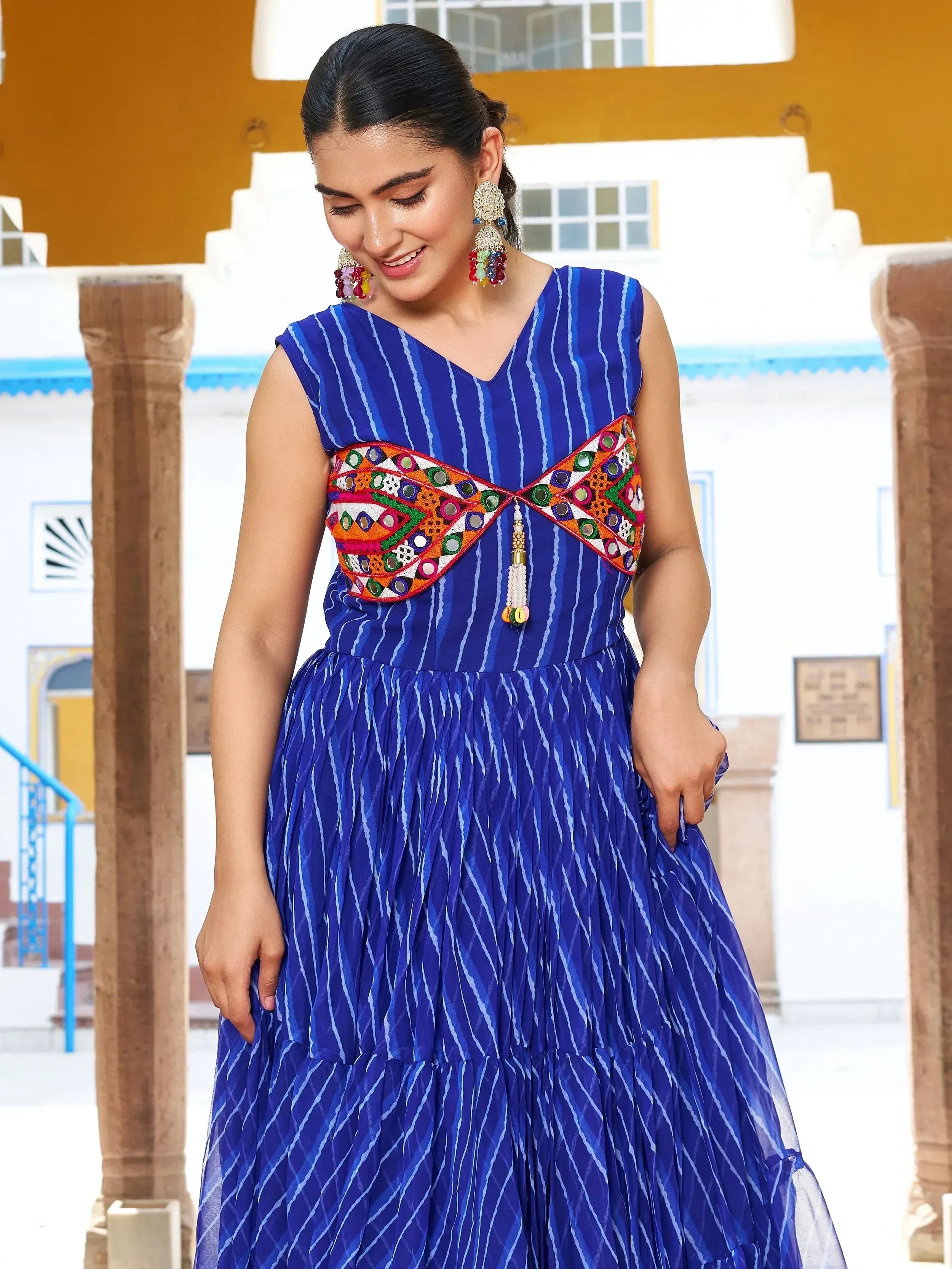 Blue striped ethnic gown with mirror work, perfect for Indian occasions and festive wear.