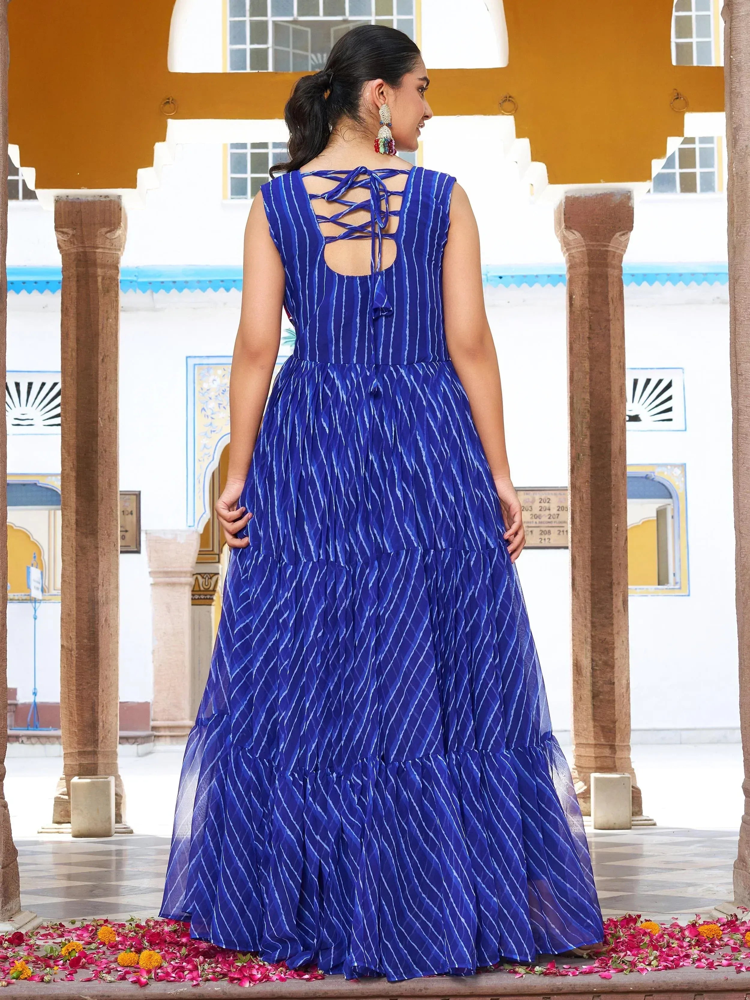 Blue striped ethnic gown with crisscross back, perfect for Indian occasions and festivals.