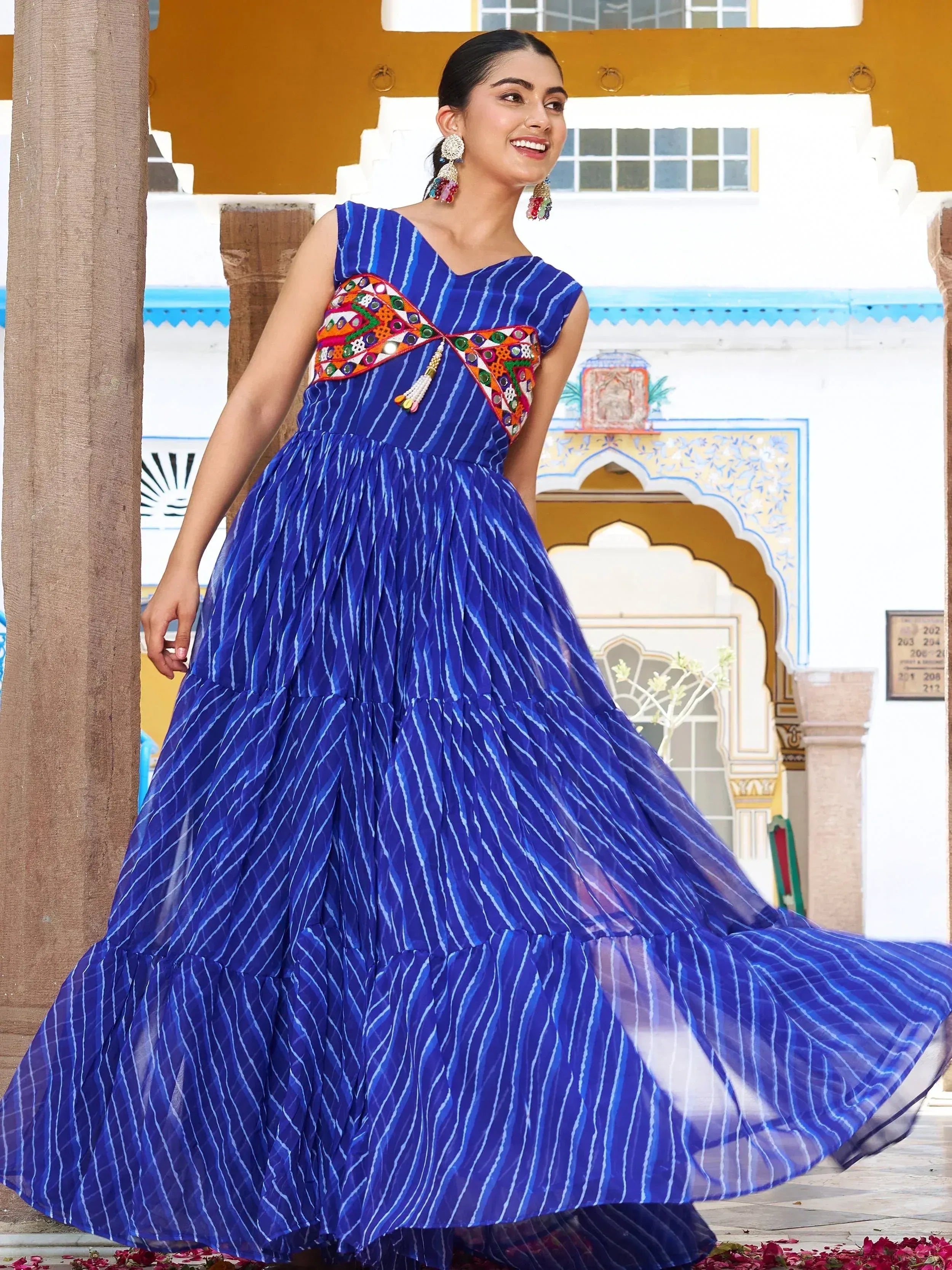 Blue striped ethnic gown with colorful mirror work, perfect for Indian occasions and festive wear.