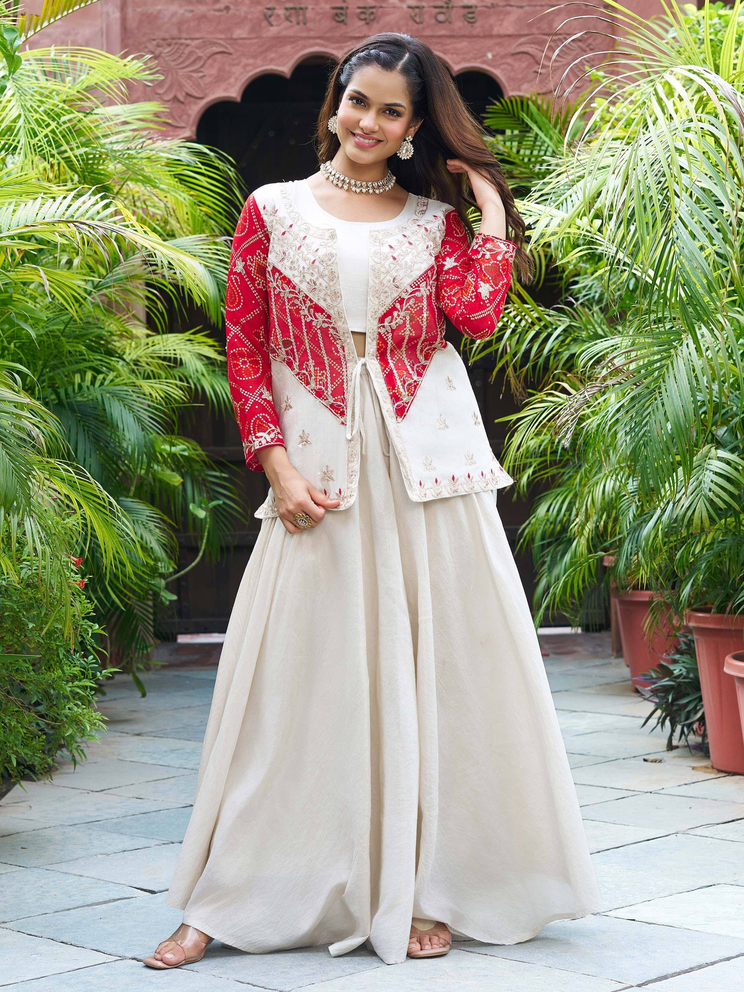 Woman in cream and red embroidered ethnic gown with floral patterns, perfect for Indian occasions
