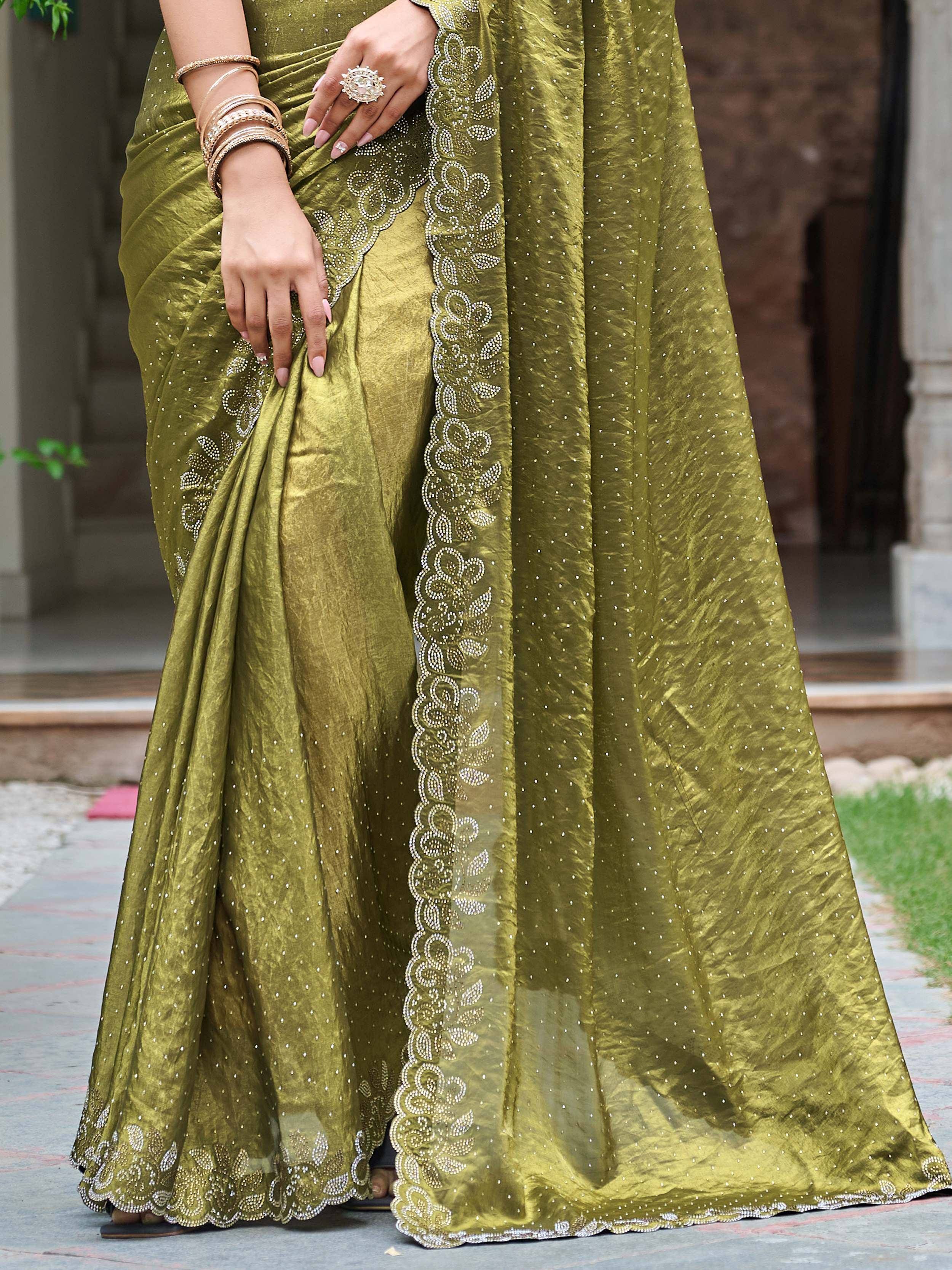 Olive green designer saree with sequin embroidery and scalloped border, perfect for ethnic occasions.