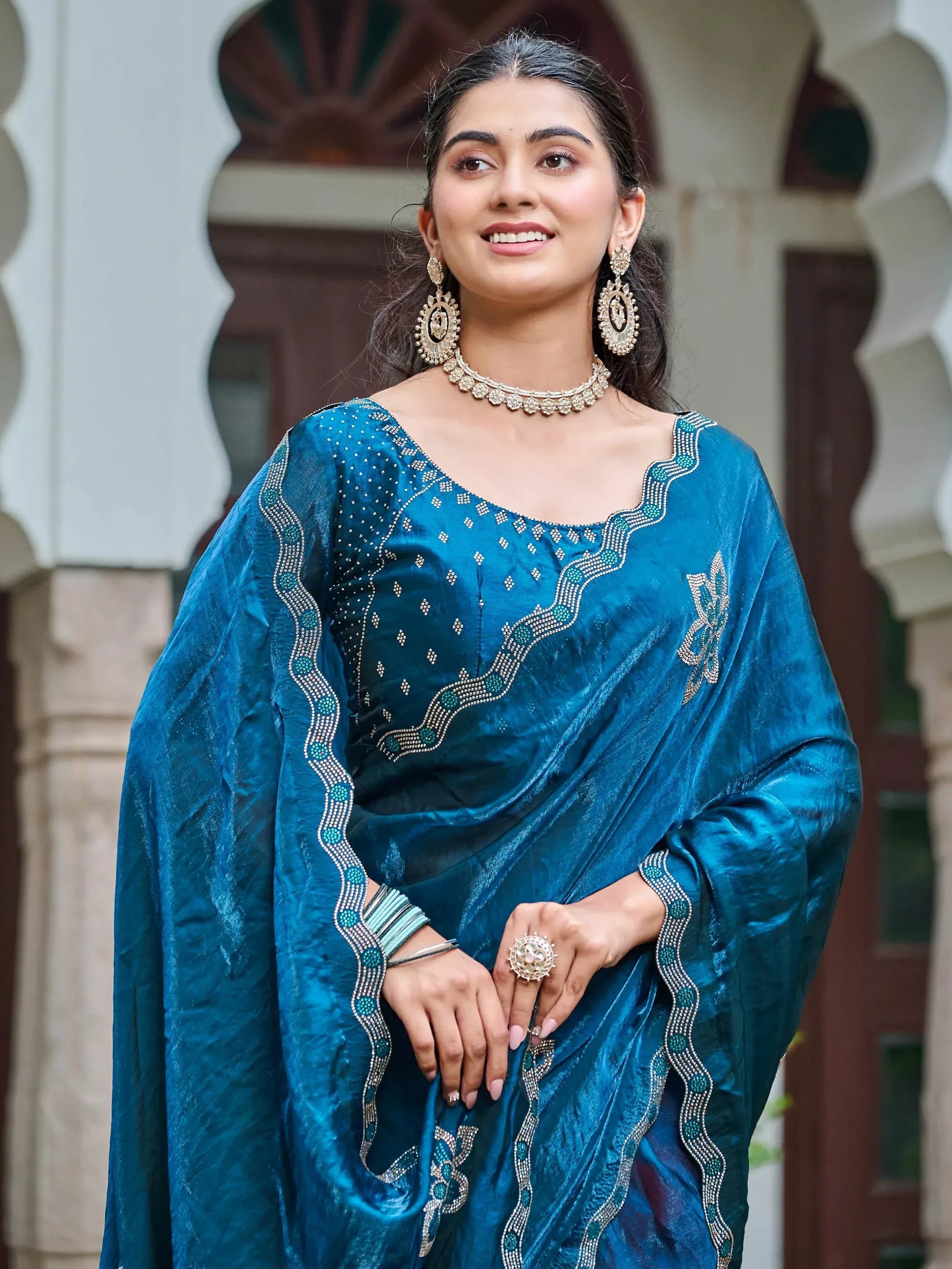 Teal velvet saree with intricate beadwork, perfect for Indian ethnic wear and festive occasions.
