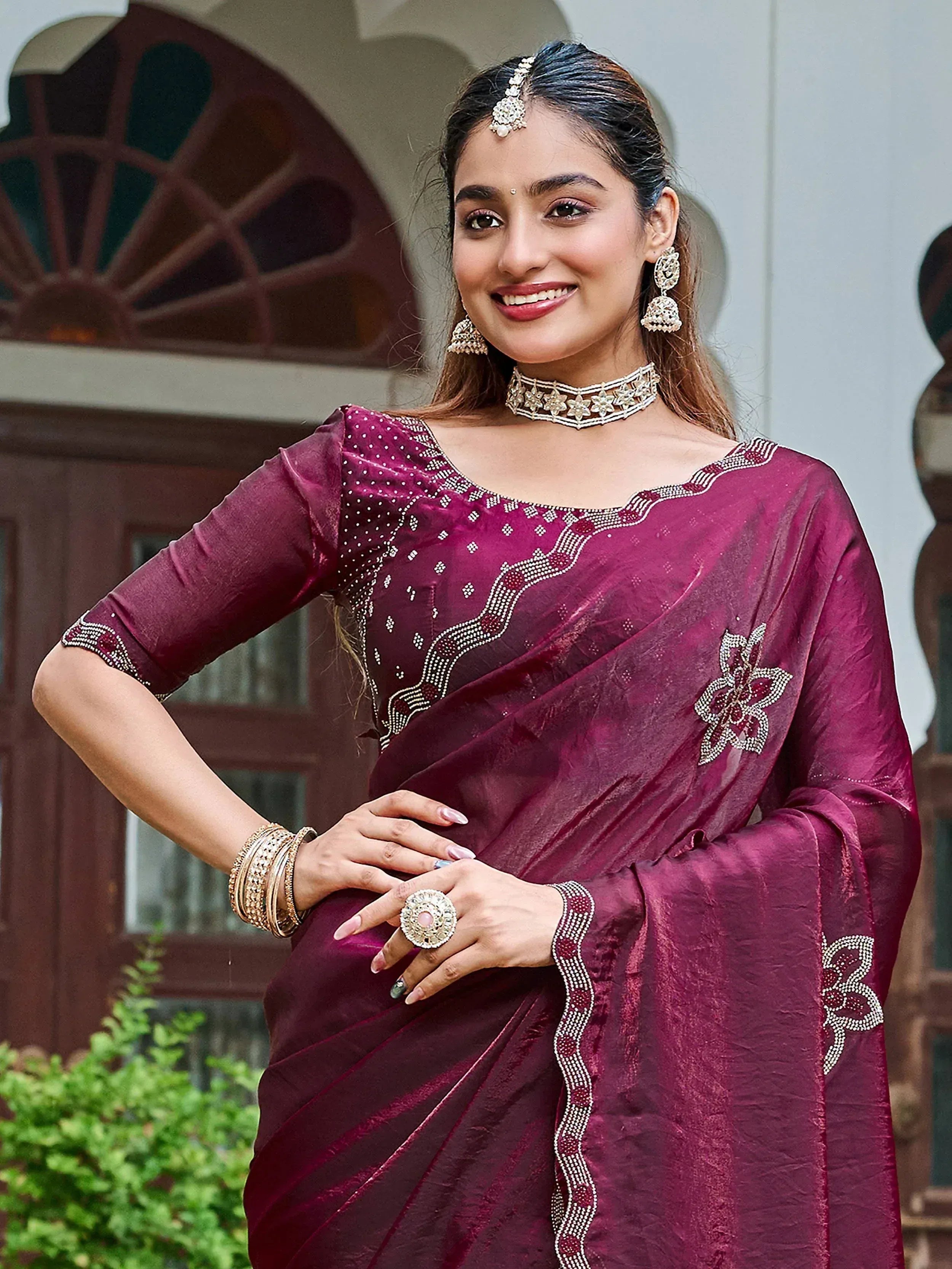 Elegant maroon saree with intricate embroidery, perfect for Indian ethnic wear occasions