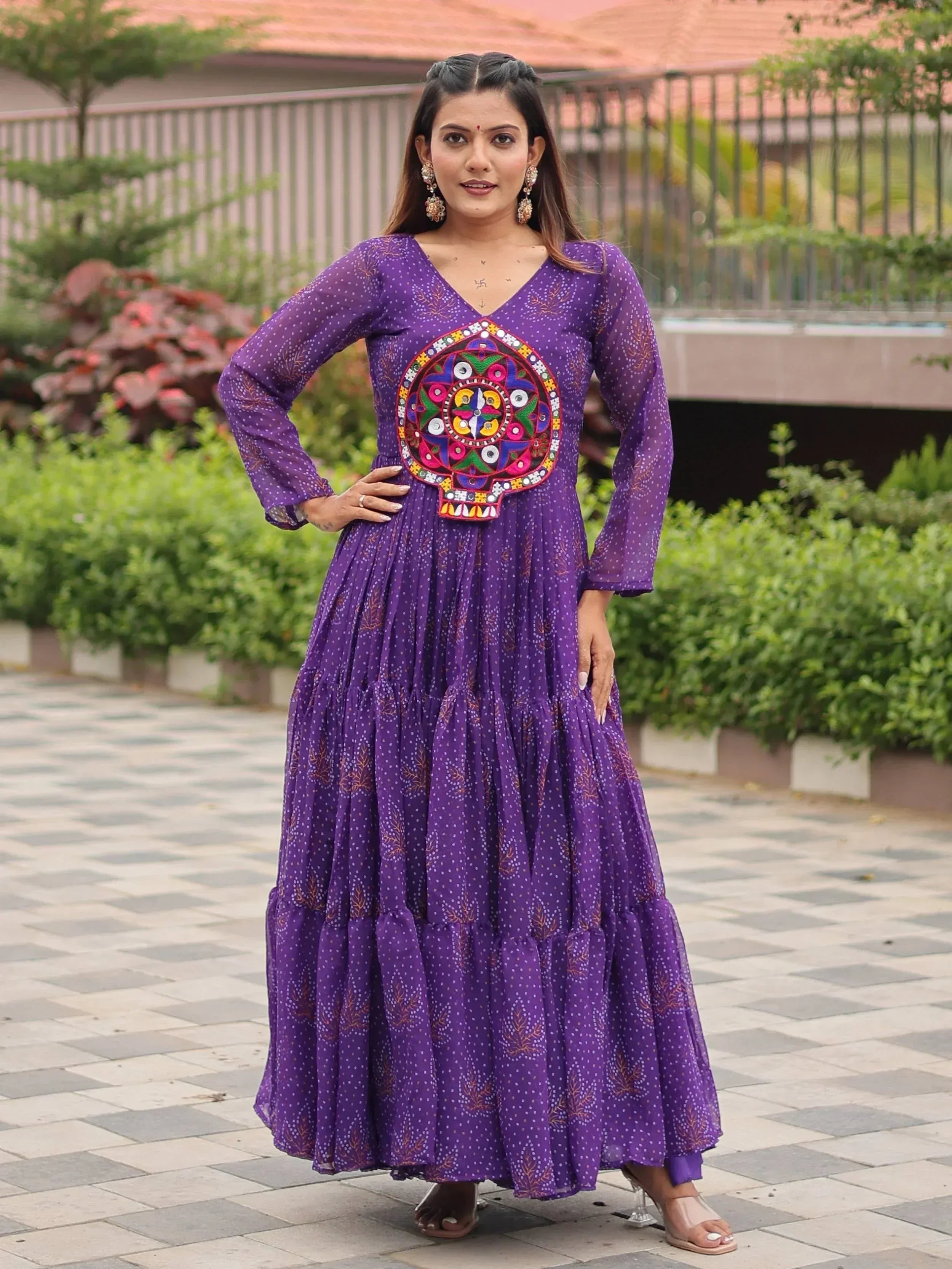 Purple ethnic gown with colorful embroidered skull design, long sleeves, and tiered skirt for women