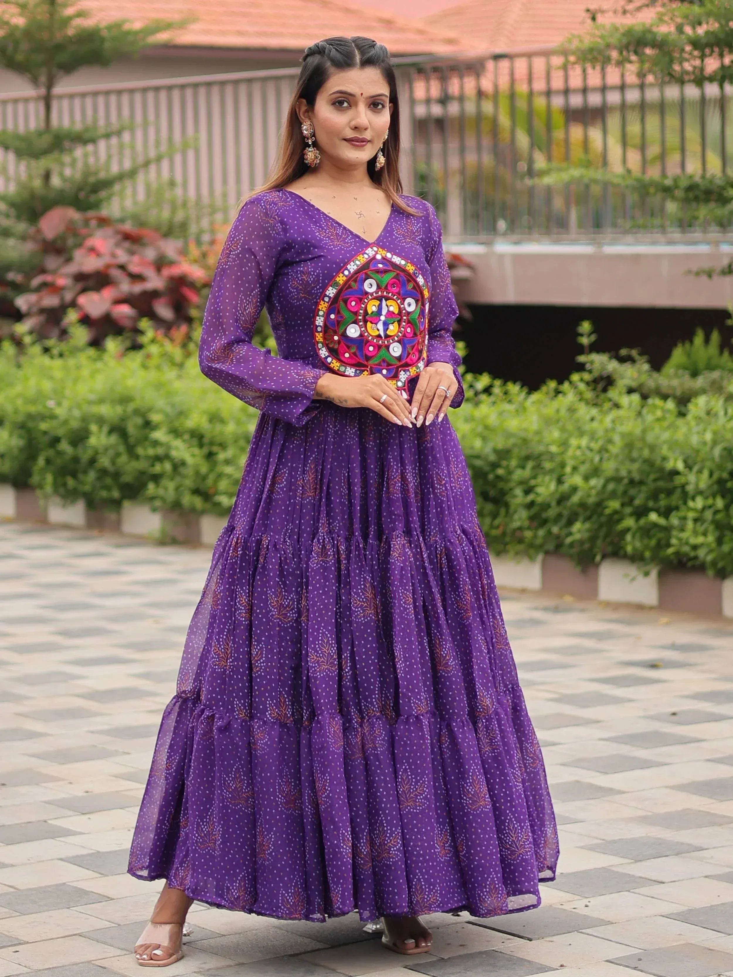 Purple ethnic gown with mirror work, perfect for Indian occasions and festive wear.