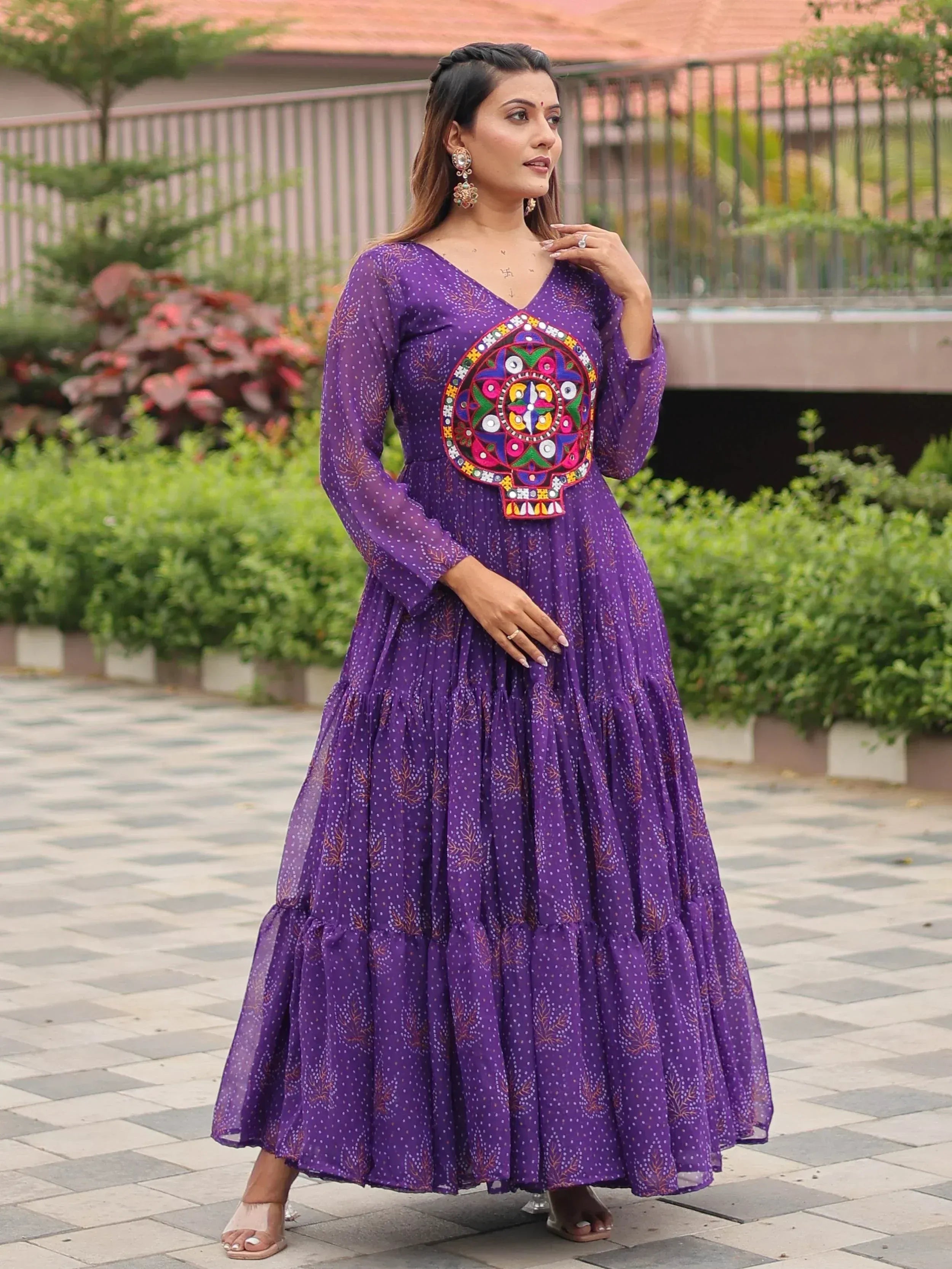 Purple ethnic gown with mirror work, perfect for Indian festivals and occasions.