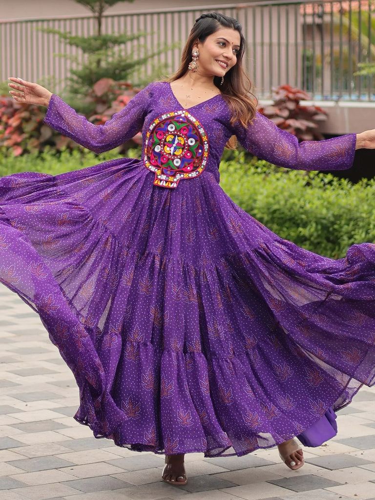 Purple ethnic gown with vibrant embroidery, perfect for festive occasions and traditional celebrations.