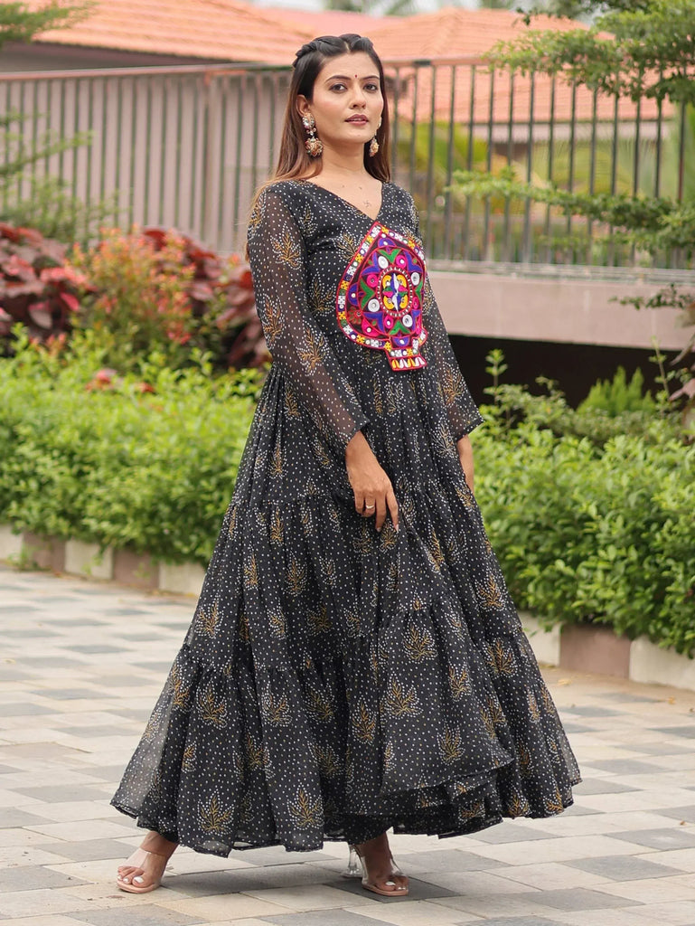 Black ethnic gown with colorful mirror work, polka dots, and tiered skirt for women