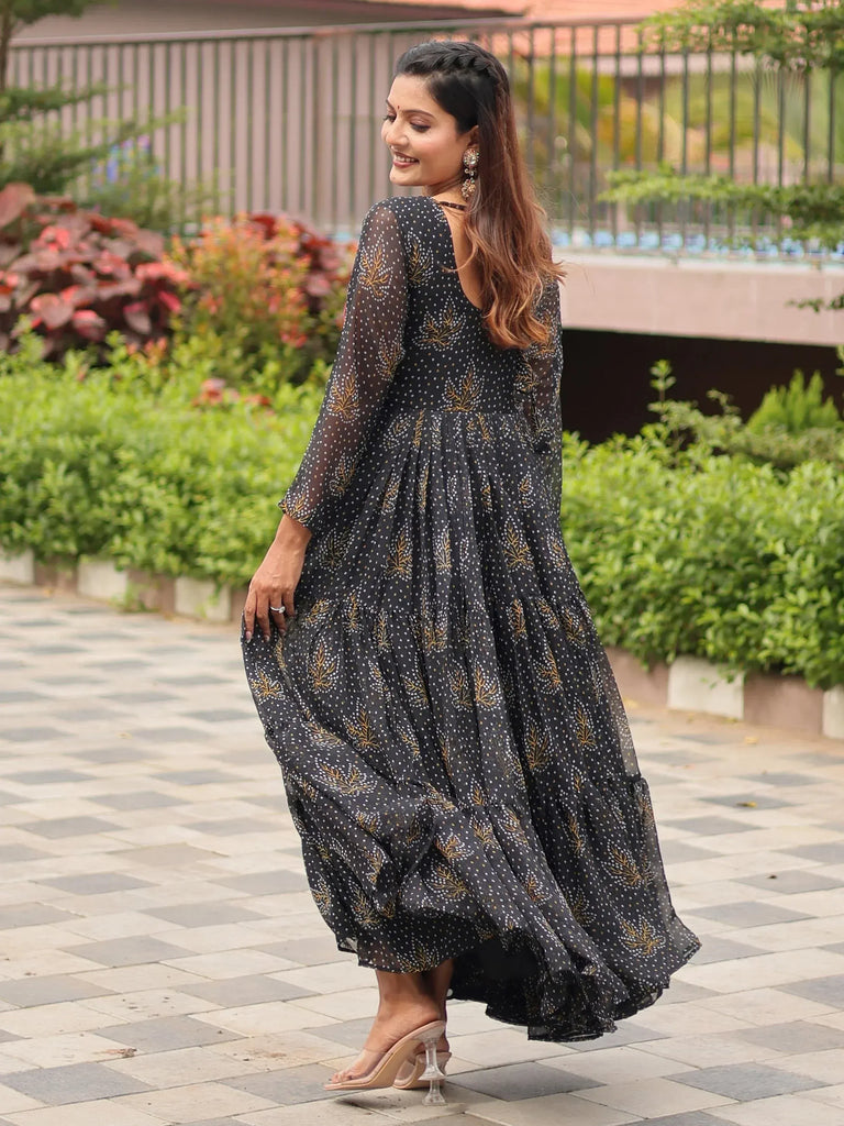 Black ethnic gown with gold leaf print, sheer sleeves, and tiered skirt for women