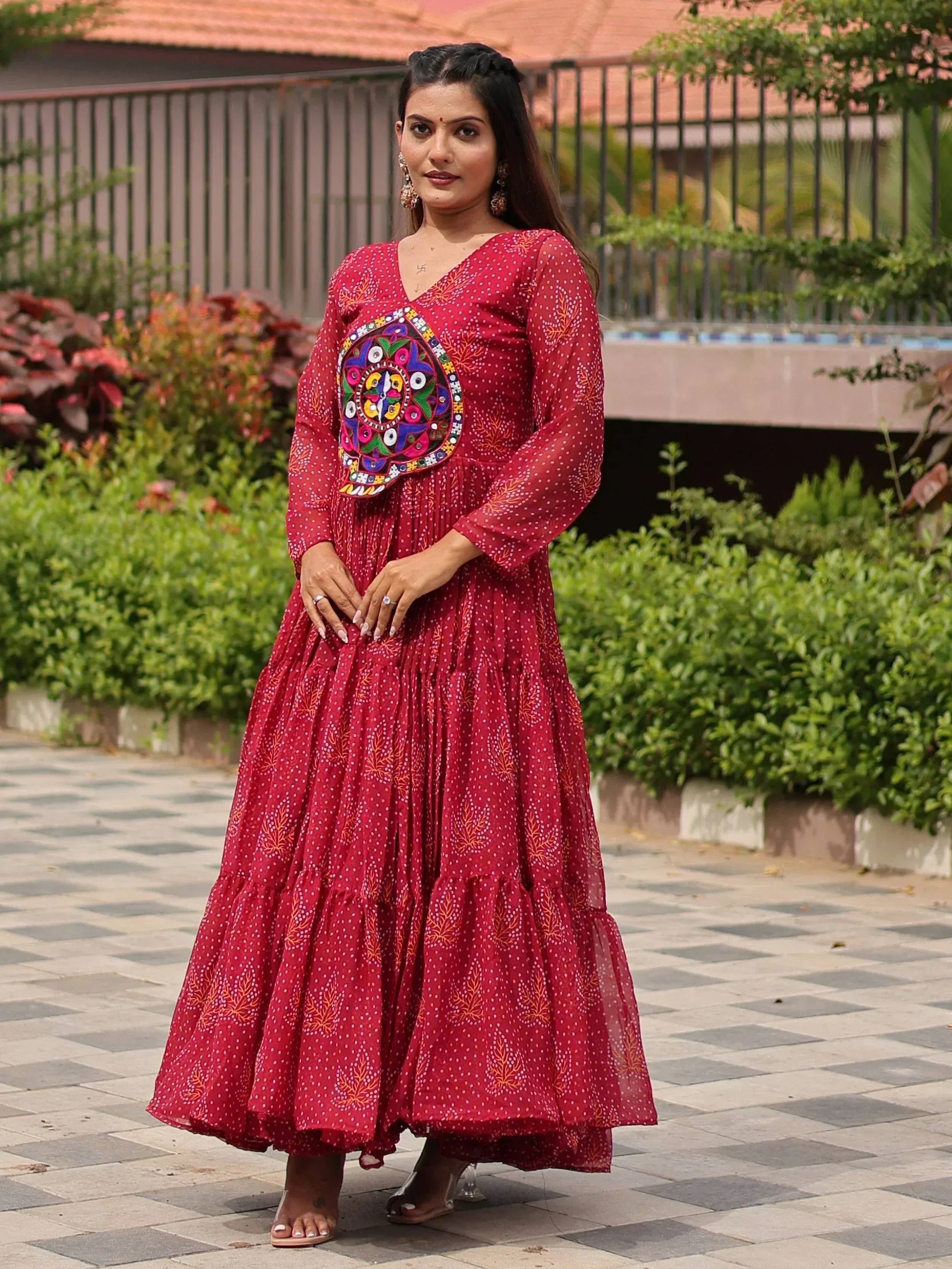 Red ethnic gown with mirror work, perfect for Indian occasions and festive wear.