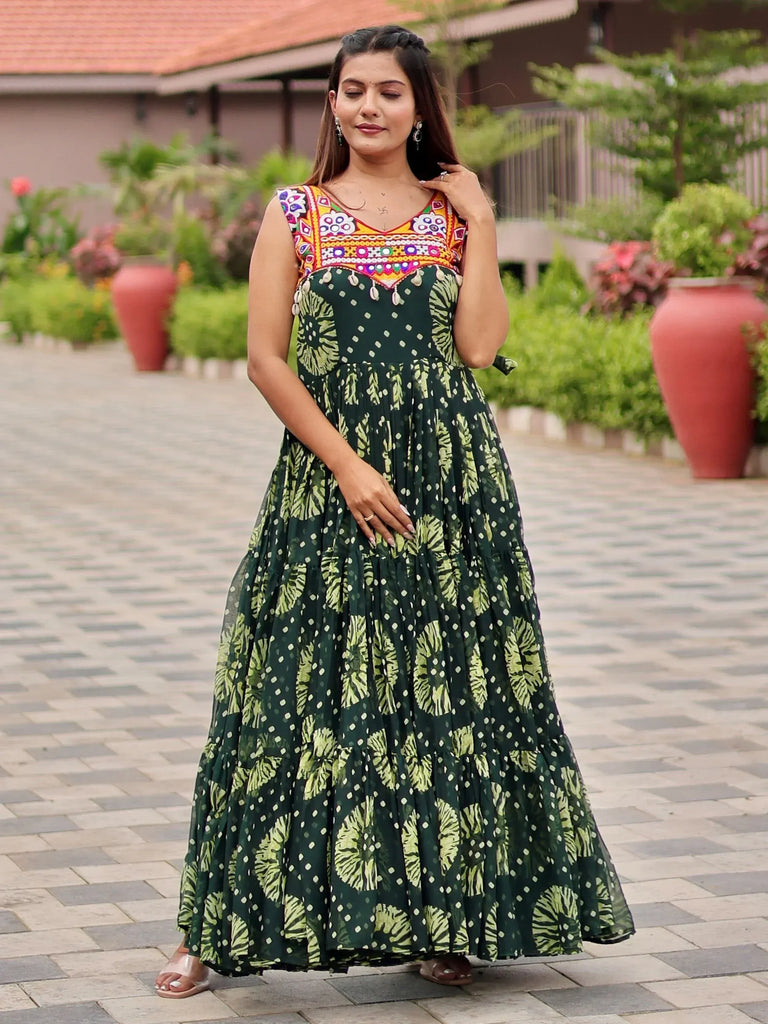 Green printed ethnic gown with colorful embroidered yoke, perfect for Indian occasions