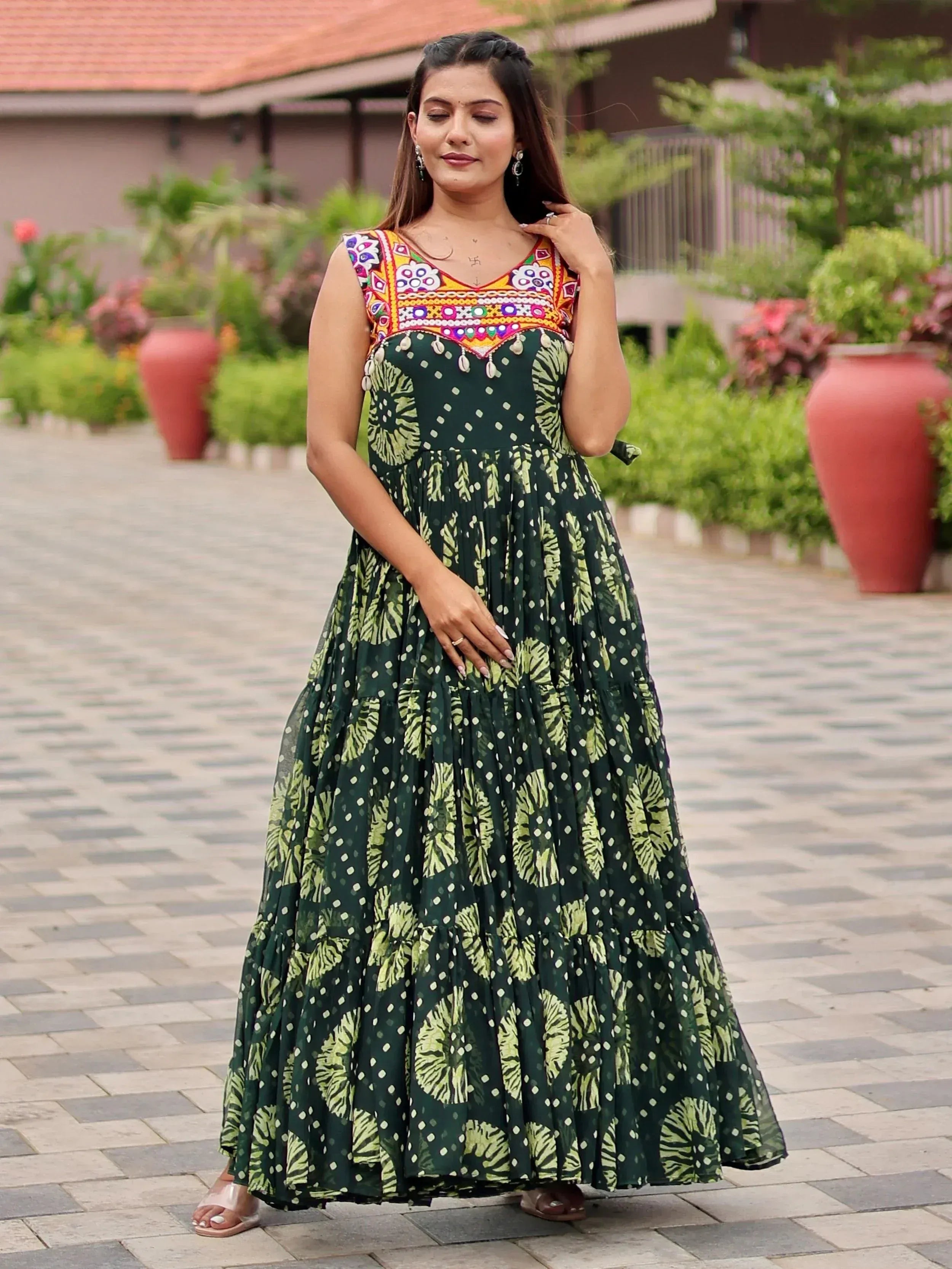 Green printed ethnic gown with colorful embroidered yoke, perfect for Indian occasions