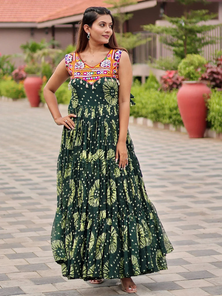 Green floral print ethnic gown with colorful embroidered neckline, perfect for Indian festive wear.