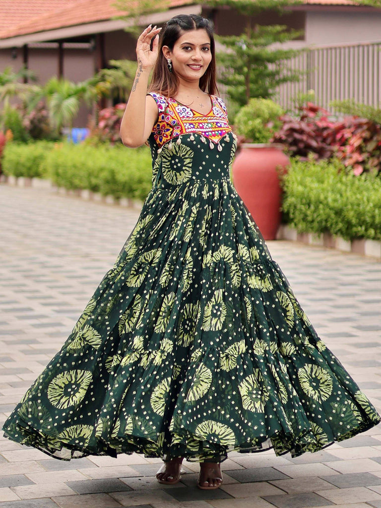 Woman in green floral ethnic gown with embroidered yoke, perfect for festive occasions and Indian wear.