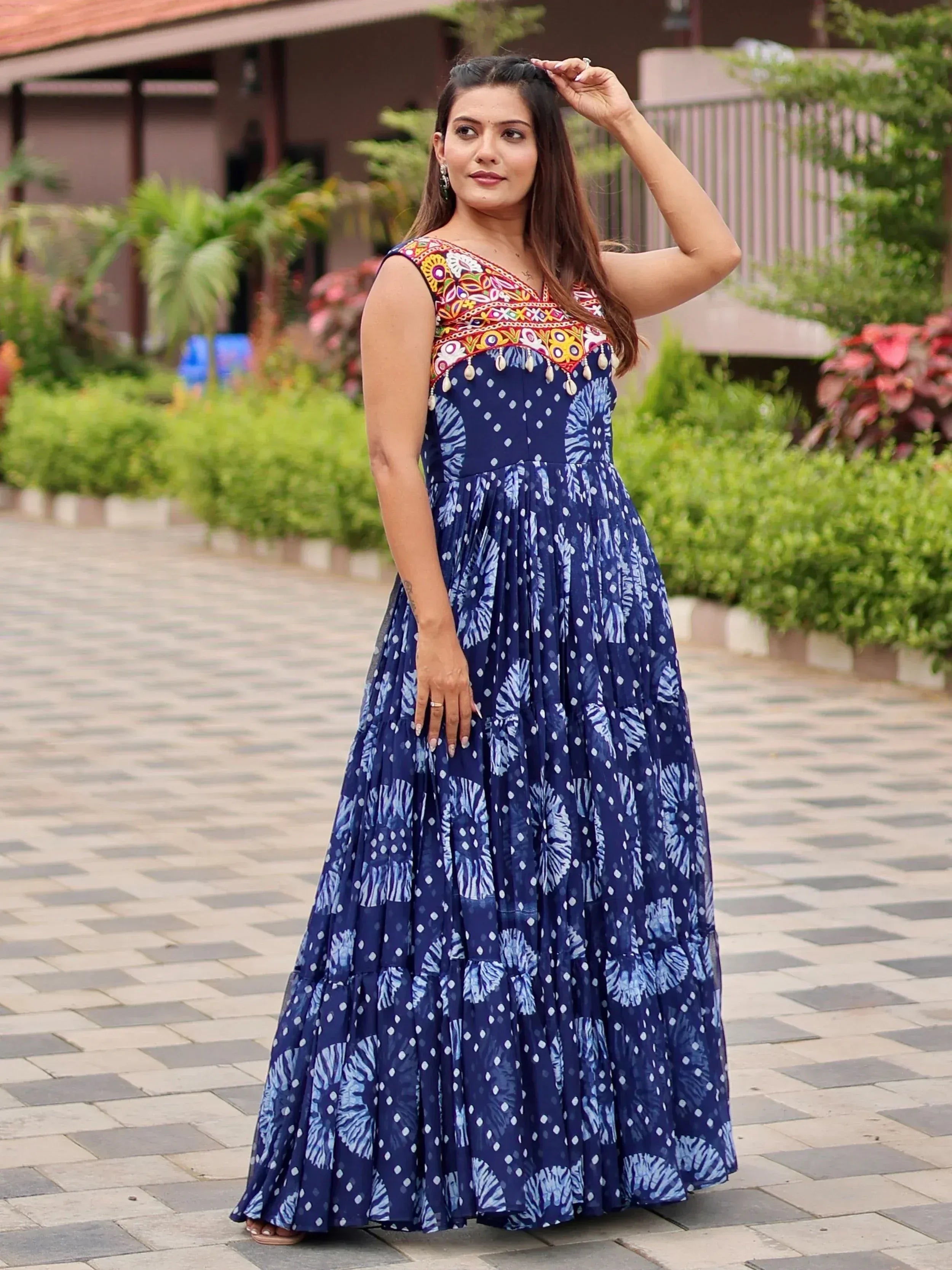 Blue ethnic gown with colorful embroidery and tie-dye print, perfect for Indian occasions