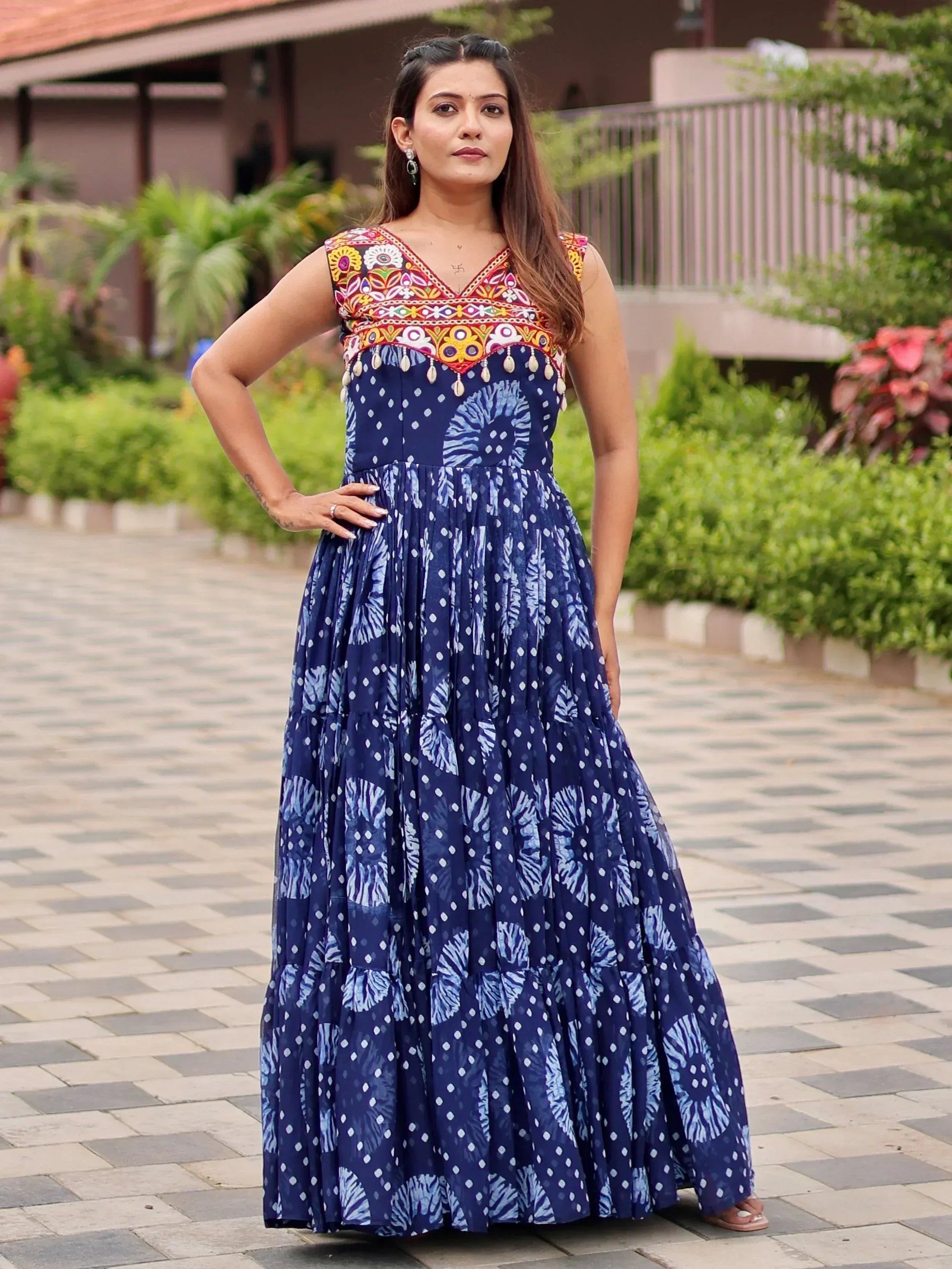 Blue ethnic gown with colorful embroidery and tie-dye print, perfect for Indian occasions