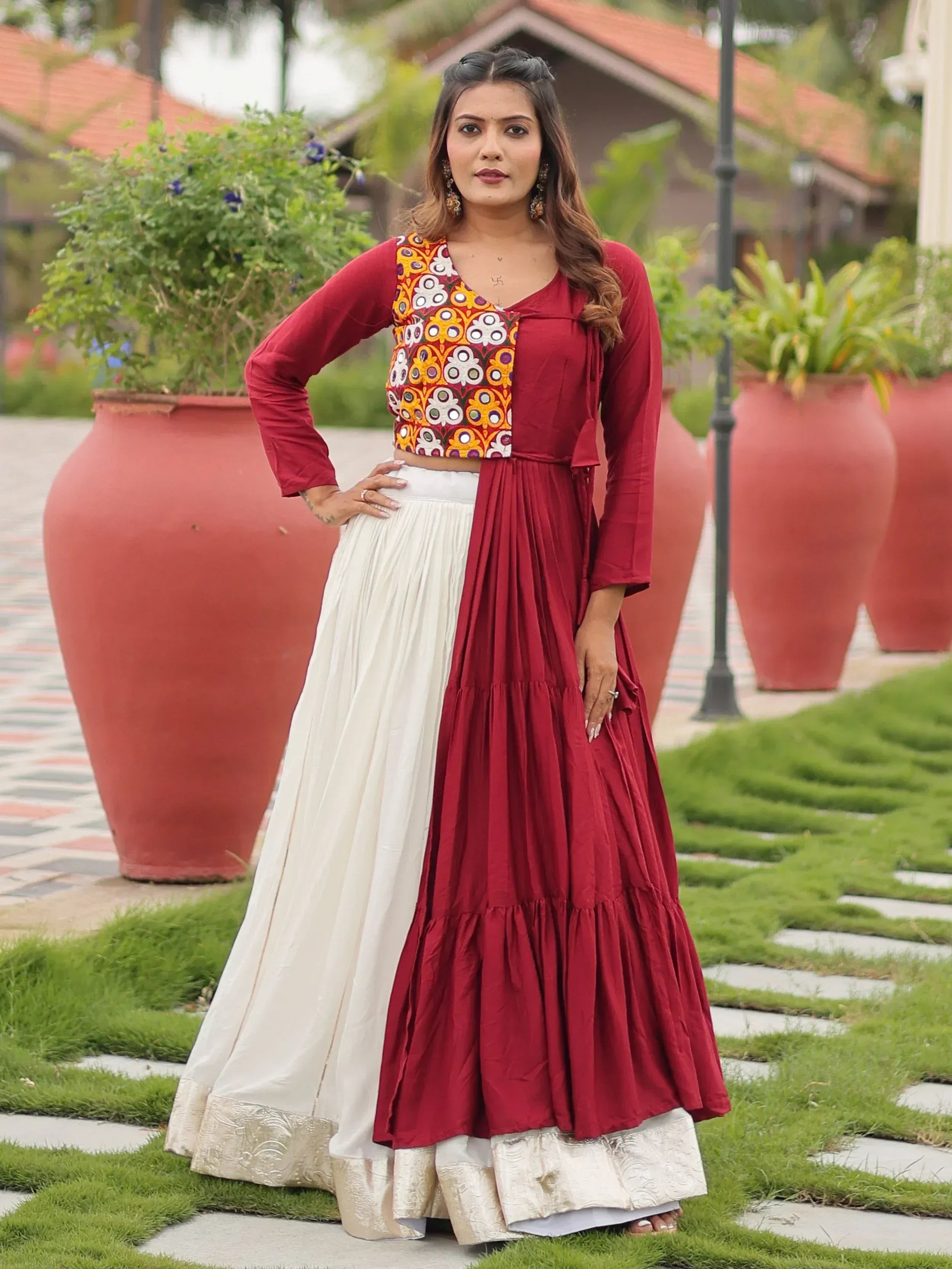 Maroon and white ethnic lehenga with embroidered crop top, perfect for Indian weddings and festive occasions.