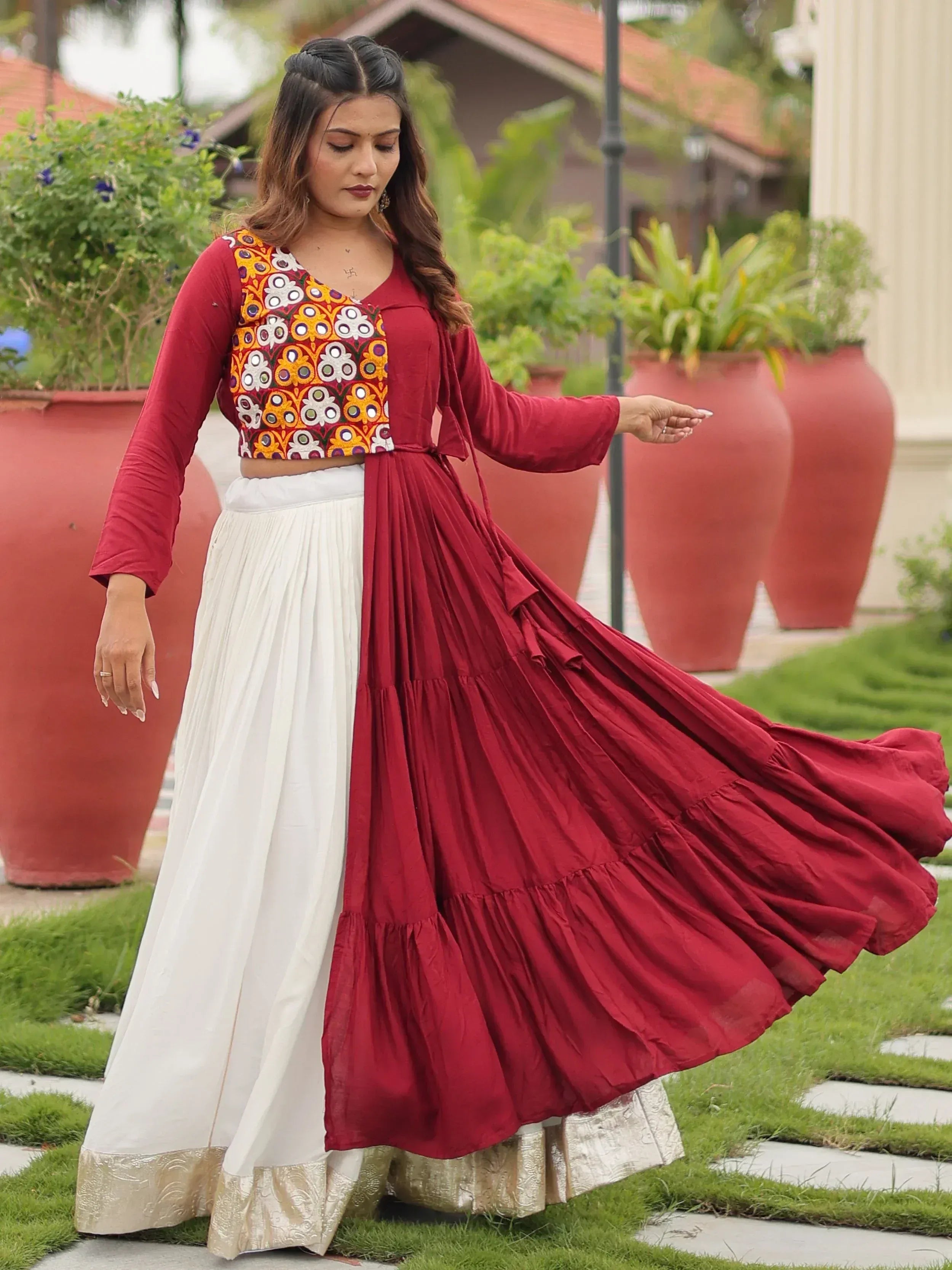 Woman in red and white ethnic lehenga with embroidered crop top, perfect for Indian festive occasions