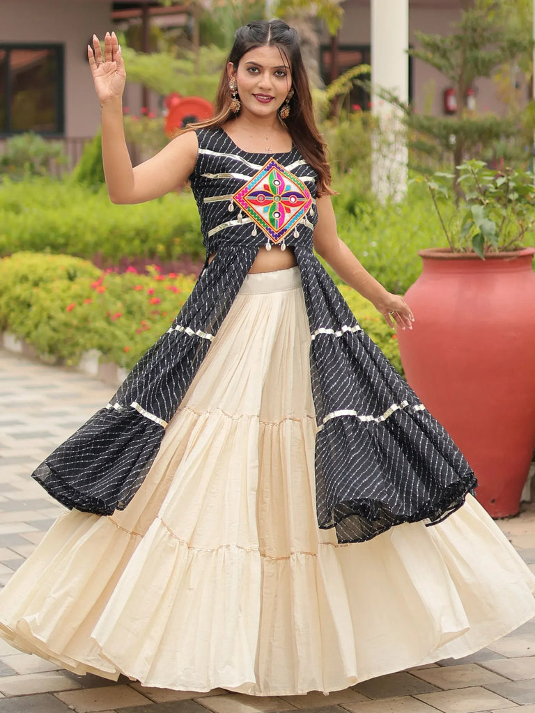 Elegant black and cream ethnic lehenga with colorful embroidery, perfect for festive occasions.