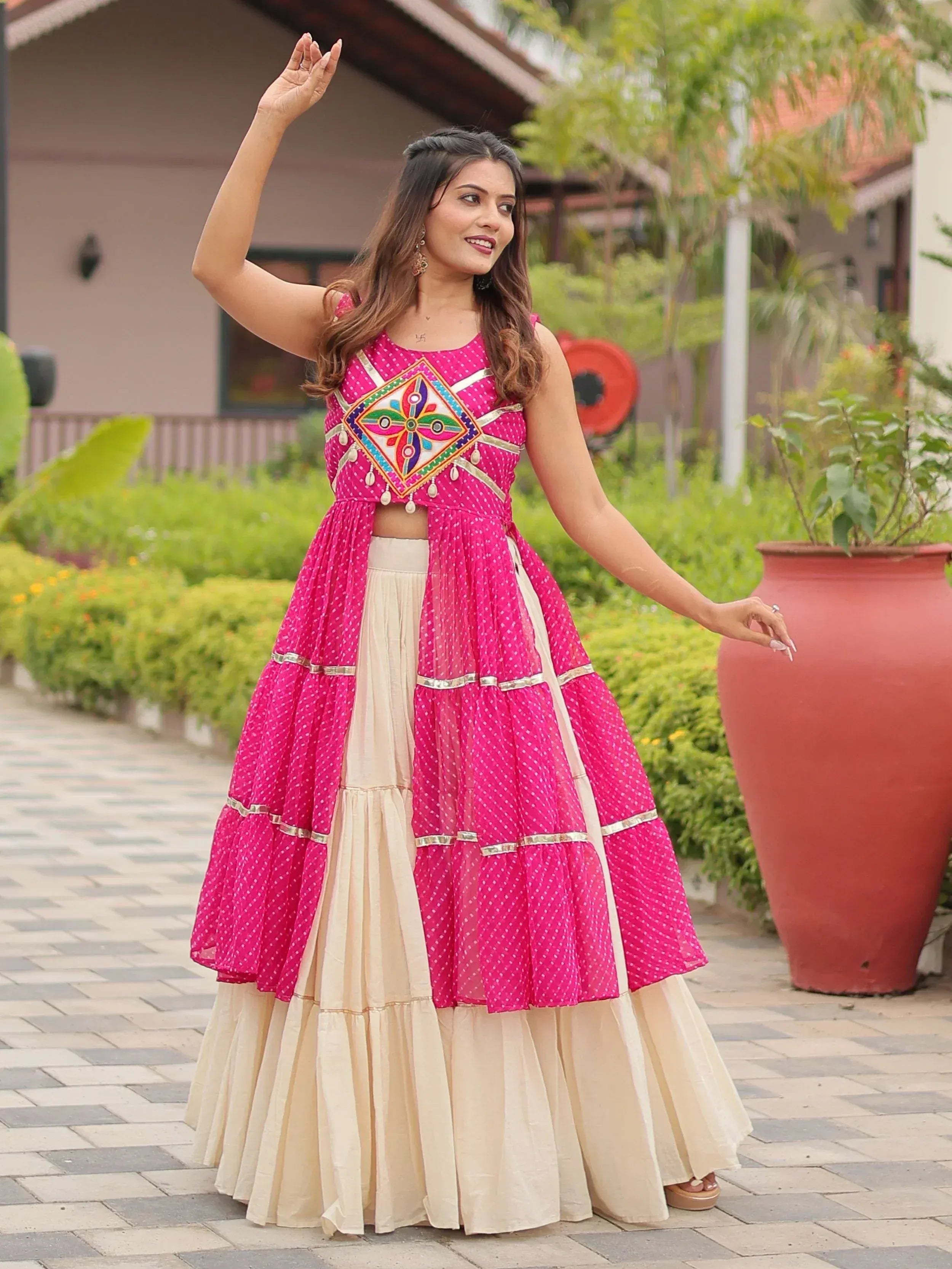 Pink and cream ethnic lehenga choli with mirror work, perfect for Indian festivals and weddings