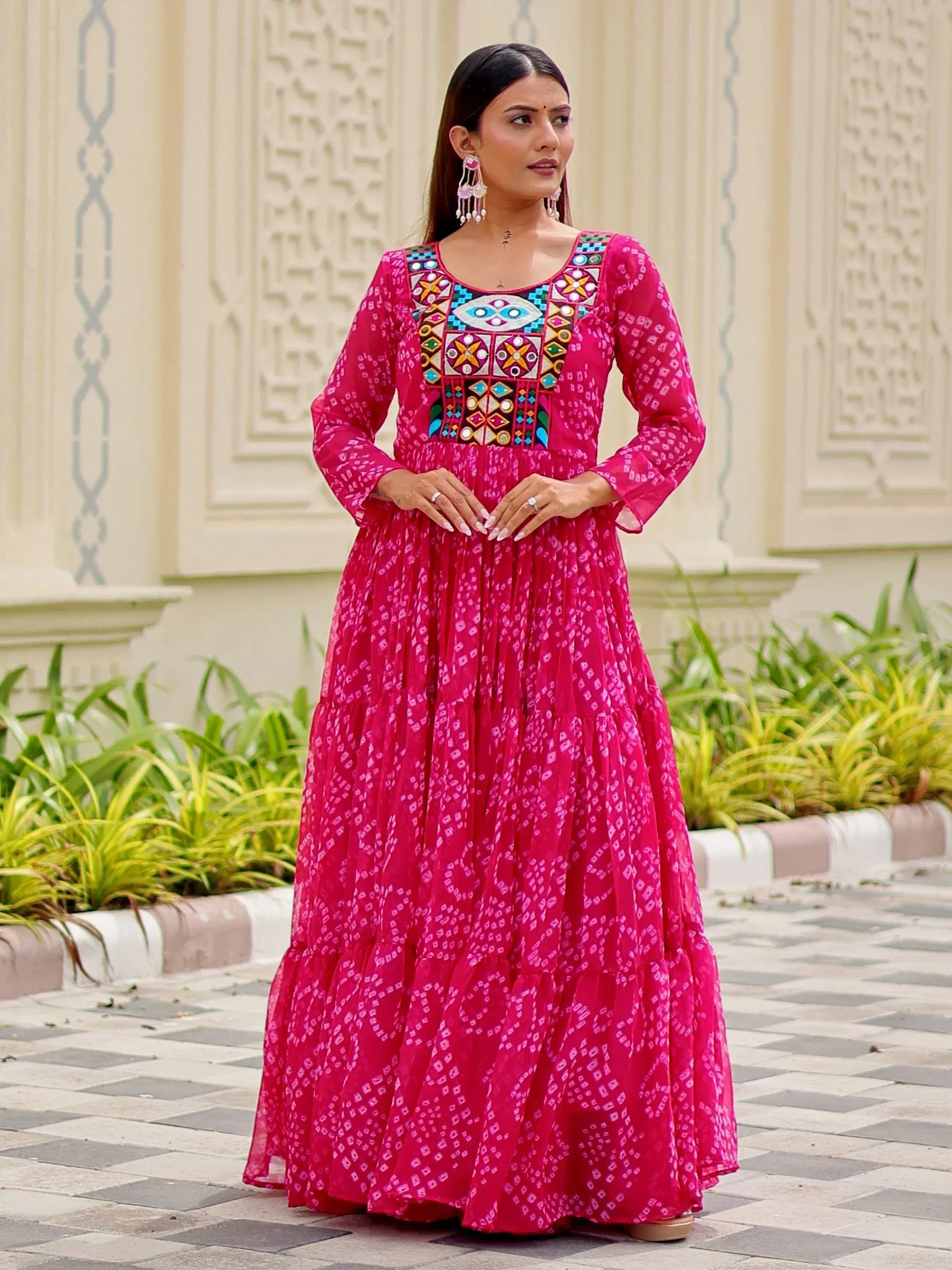 Pink ethnic gown with mirror work and geometric print, perfect for Indian festive occasions