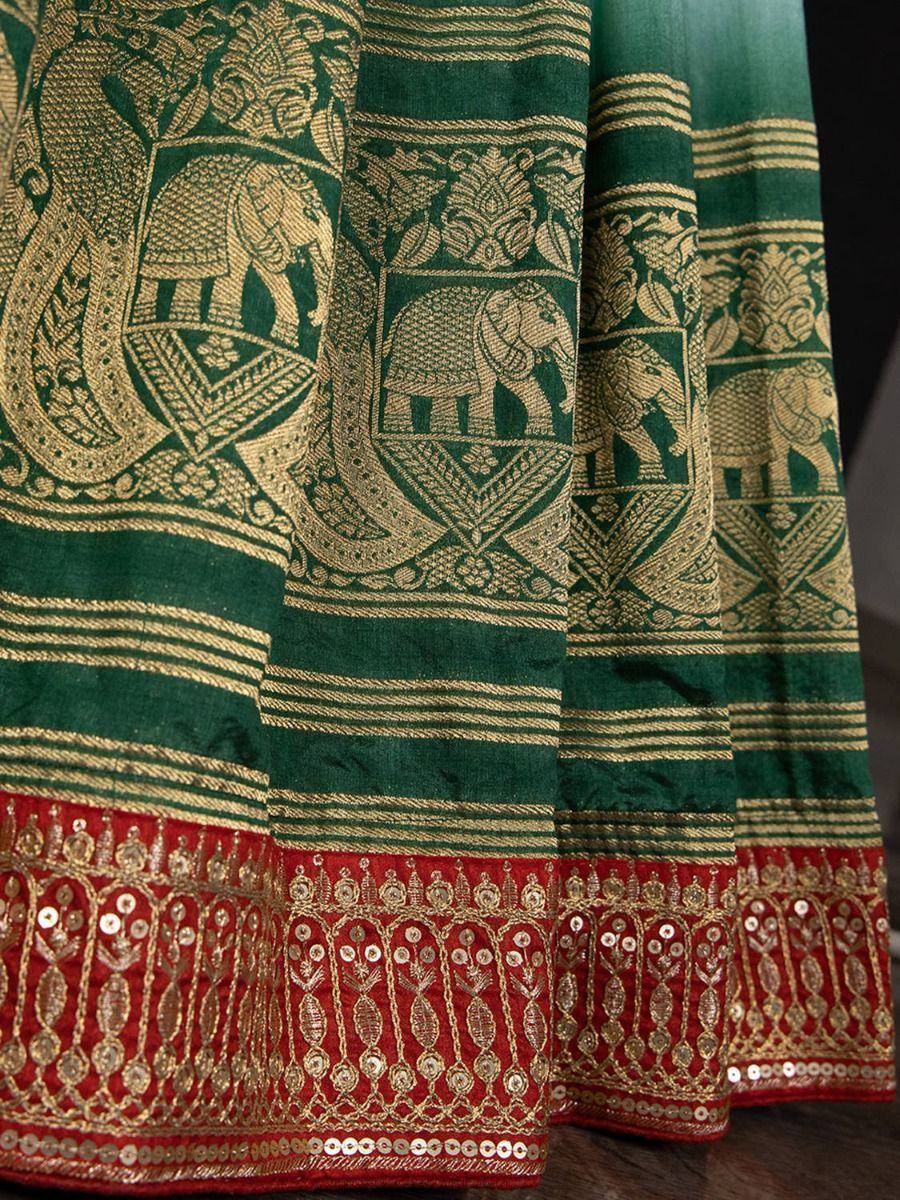 Green and gold ethnic saree with elephant motifs and red sequin border