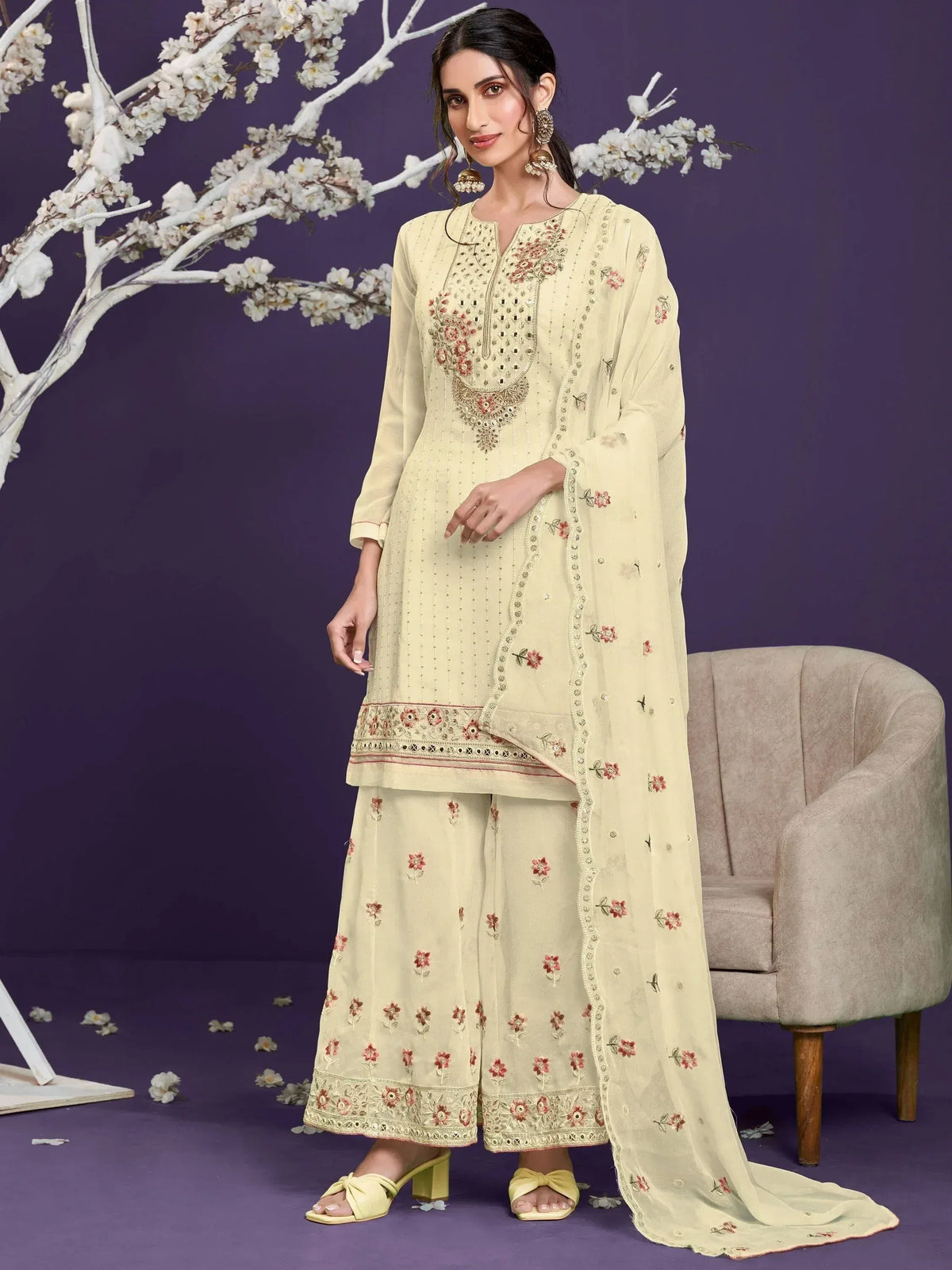 Elegant cream embroidered salwar kameez with floral motifs, perfect for Indian ethnic wear occasions.