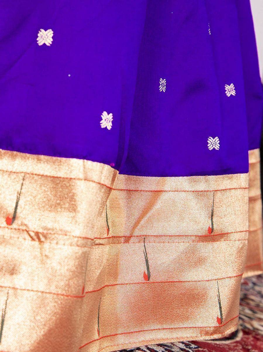 Purple ethnic saree with white floral embroidery and gold border, ideal for Indian festive wear