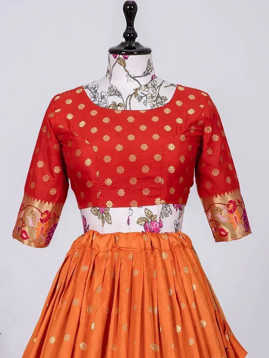 Red and orange floral printed ethnic lehenga choli with gold motifs and embroidered sleeves