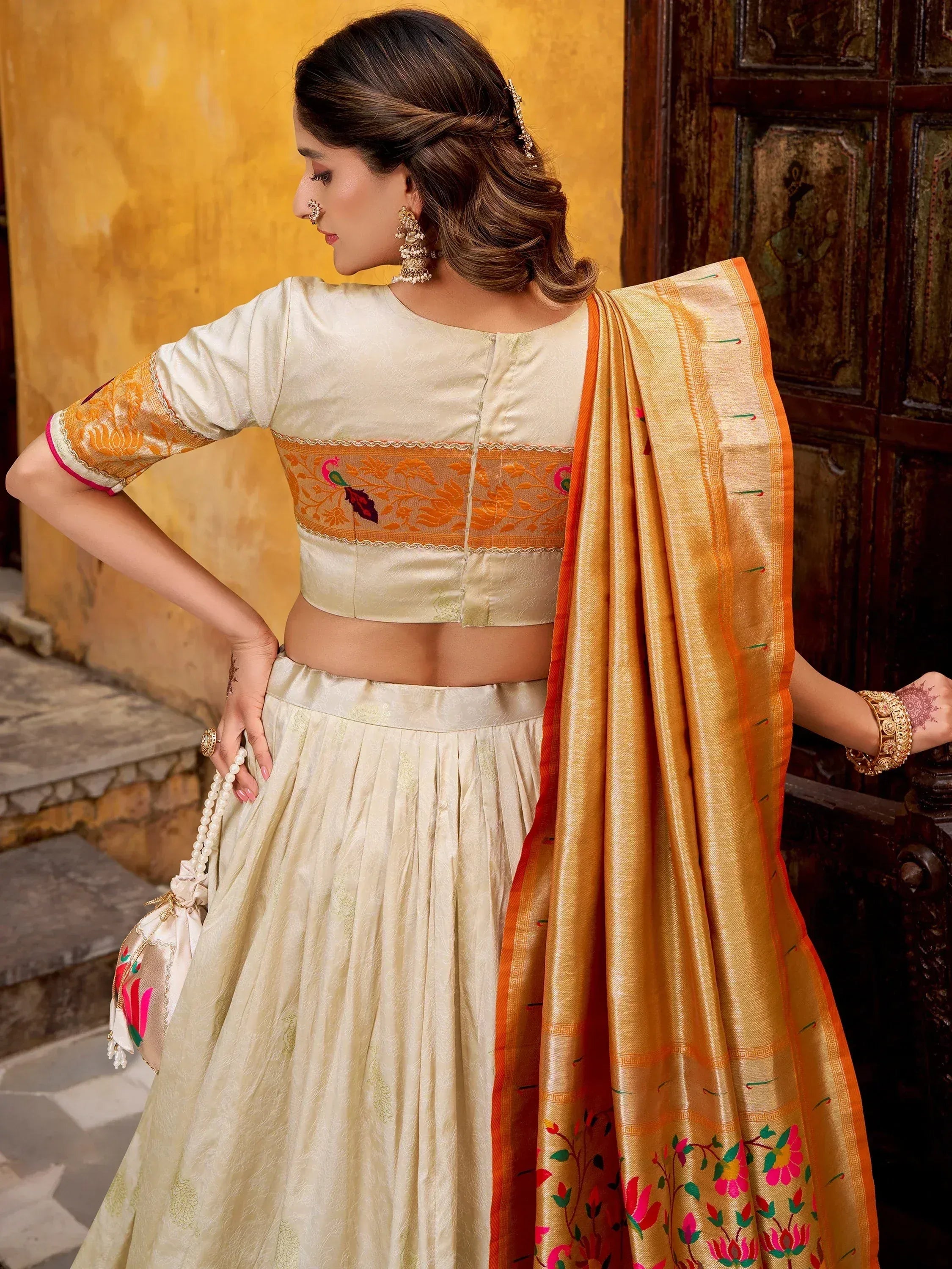 Dazzling Off-White Zari Weaving Silk Function Wear Lehenga Choli