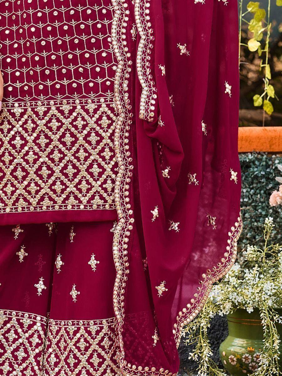 Maroon ethnic salwar kameez with gold embroidery and dupatta, perfect for Indian weddings and festive occasions