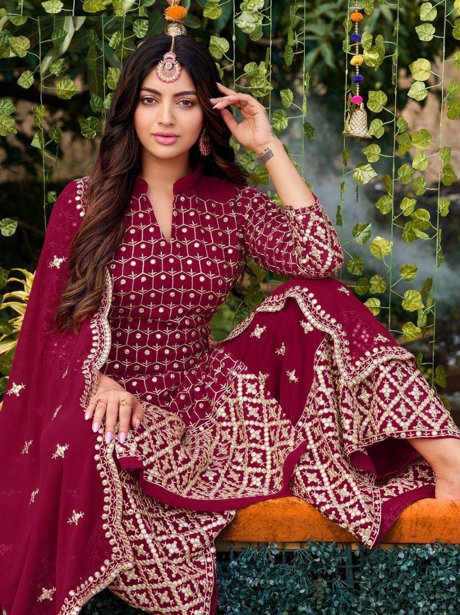 Maroon ethnic salwar kameez with gold embroidery, perfect for Indian festive occasions