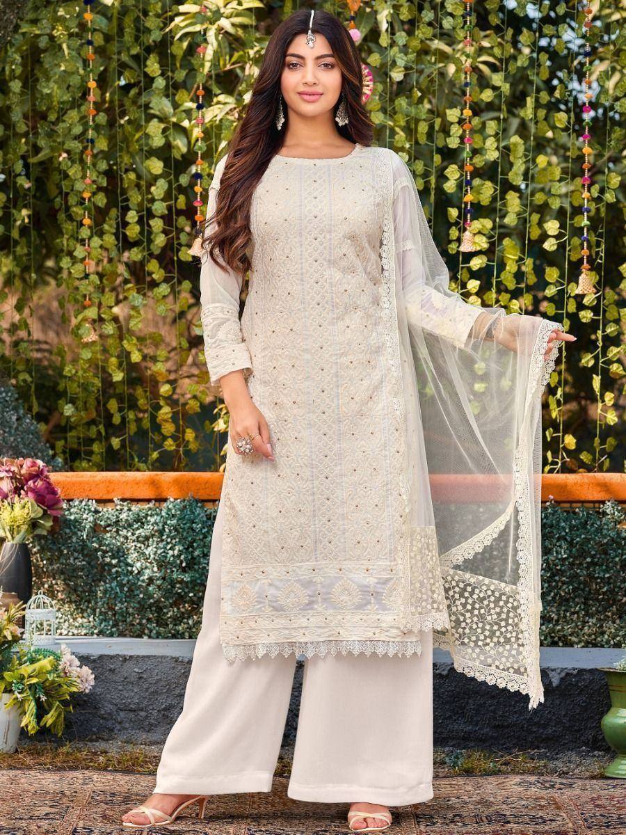 Elegant white embroidered salwar kameez with lace dupatta, perfect for ethnic occasions