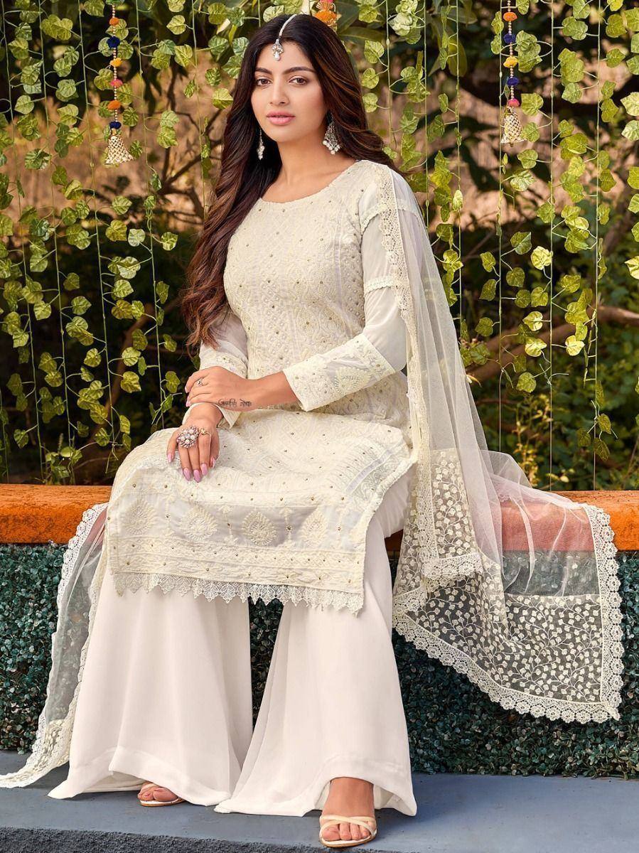 Elegant white embroidered salwar kameez with lace dupatta, perfect for ethnic occasions