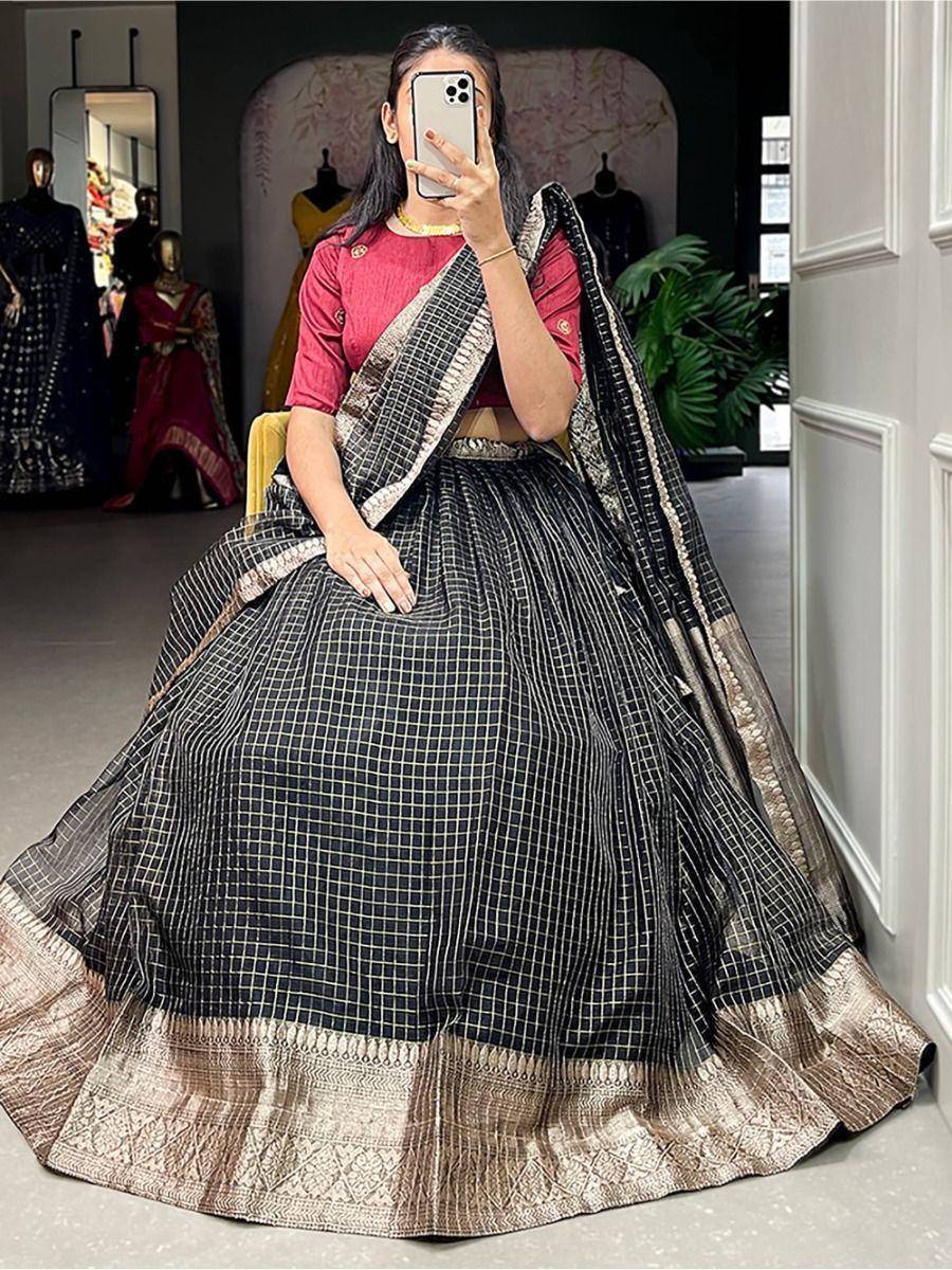 Black and gold checkered lehenga choli with embroidered border, styled with red blouse for Indian ethnic wear