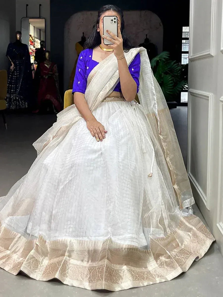 White lehenga with gold border and purple blouse, Indian ethnic wear for weddings or festivals