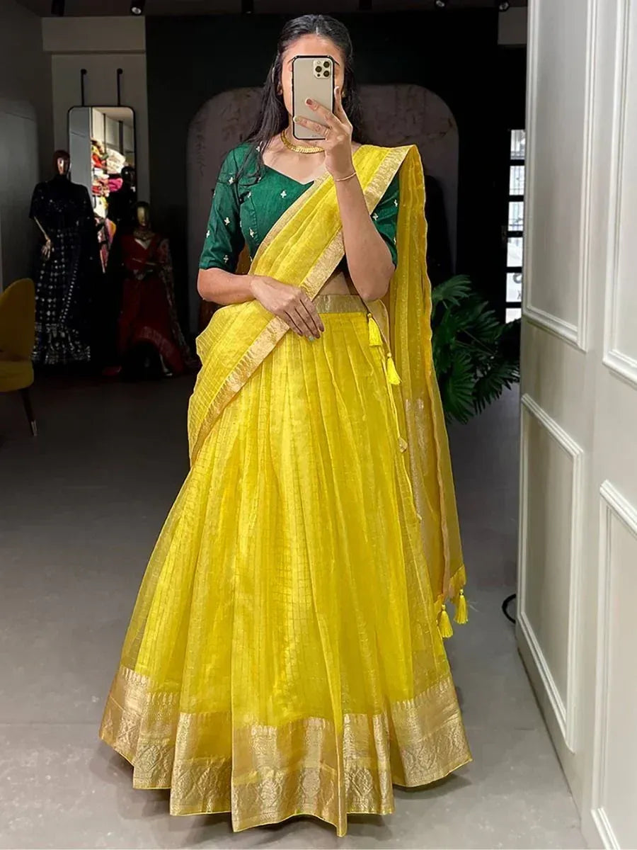 Vibrant yellow lehenga choli with green blouse, perfect for Indian ethnic wear and festive occasions