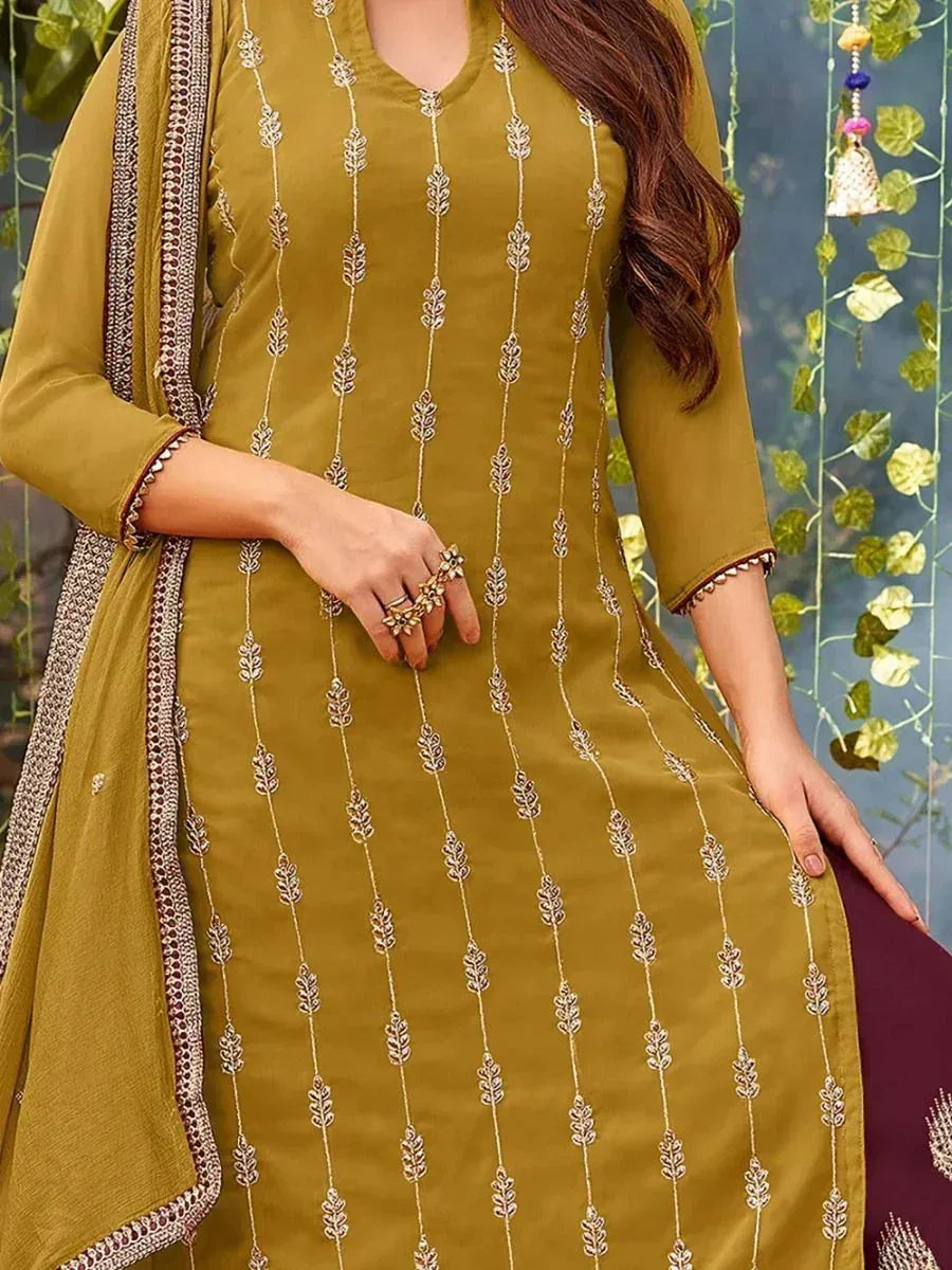 Olive green embroidered salwar kameez with leaf motifs, perfect for ethnic wear and festive occasions.