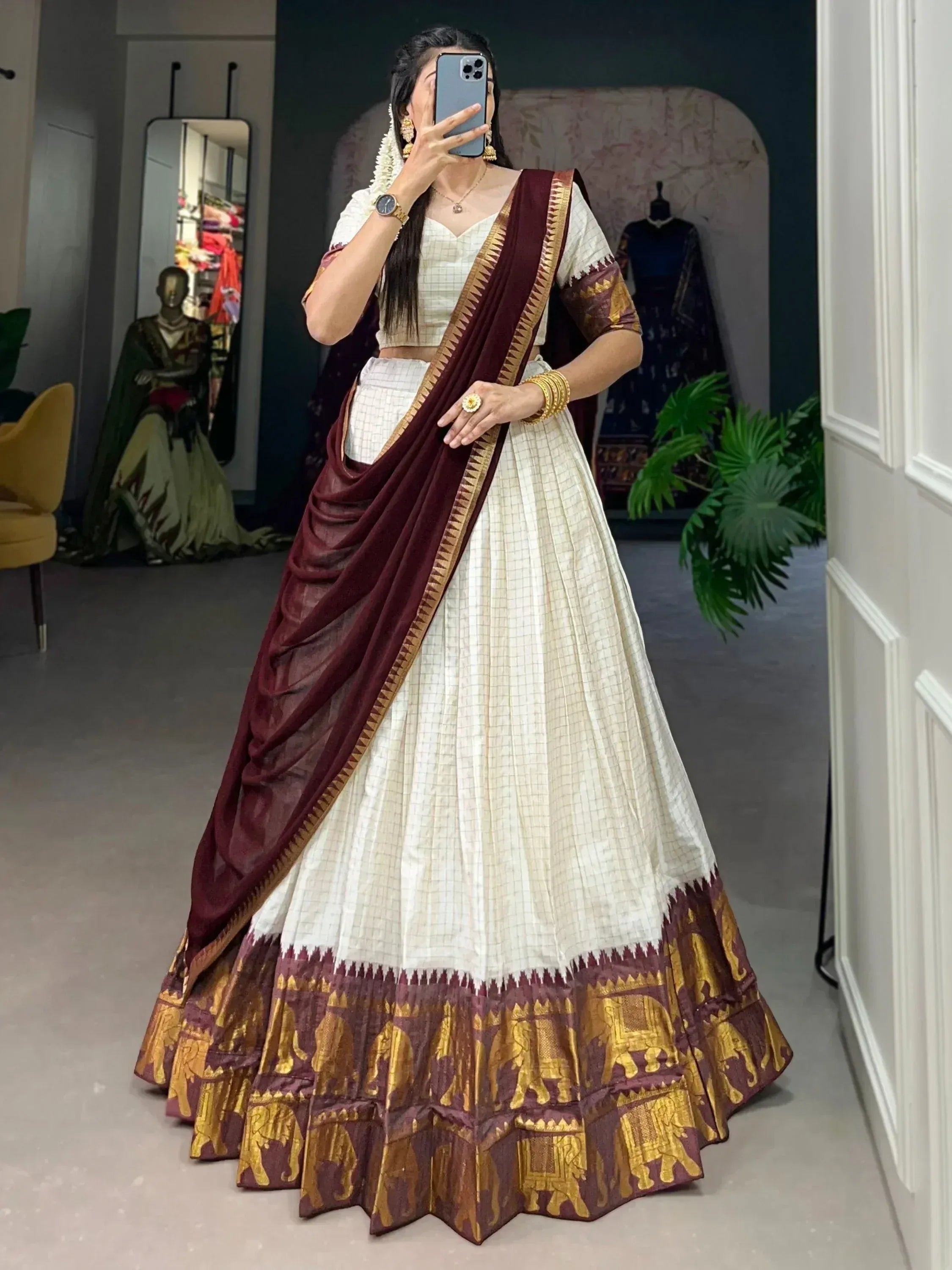White and maroon lehenga choli with gold elephant print, perfect for Indian ethnic wear occasions