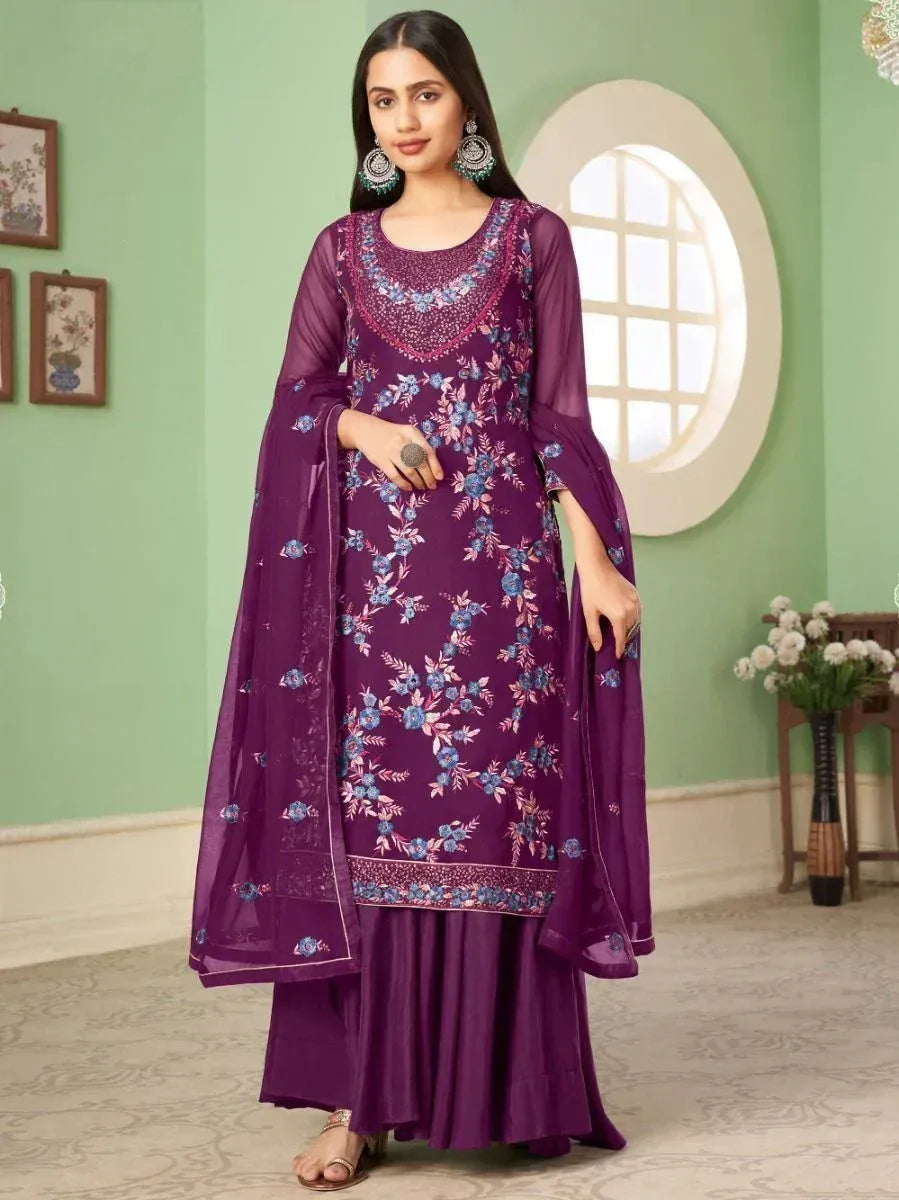 Woman wearing purple floral embroidered Indian ethnic gown with matching dupatta