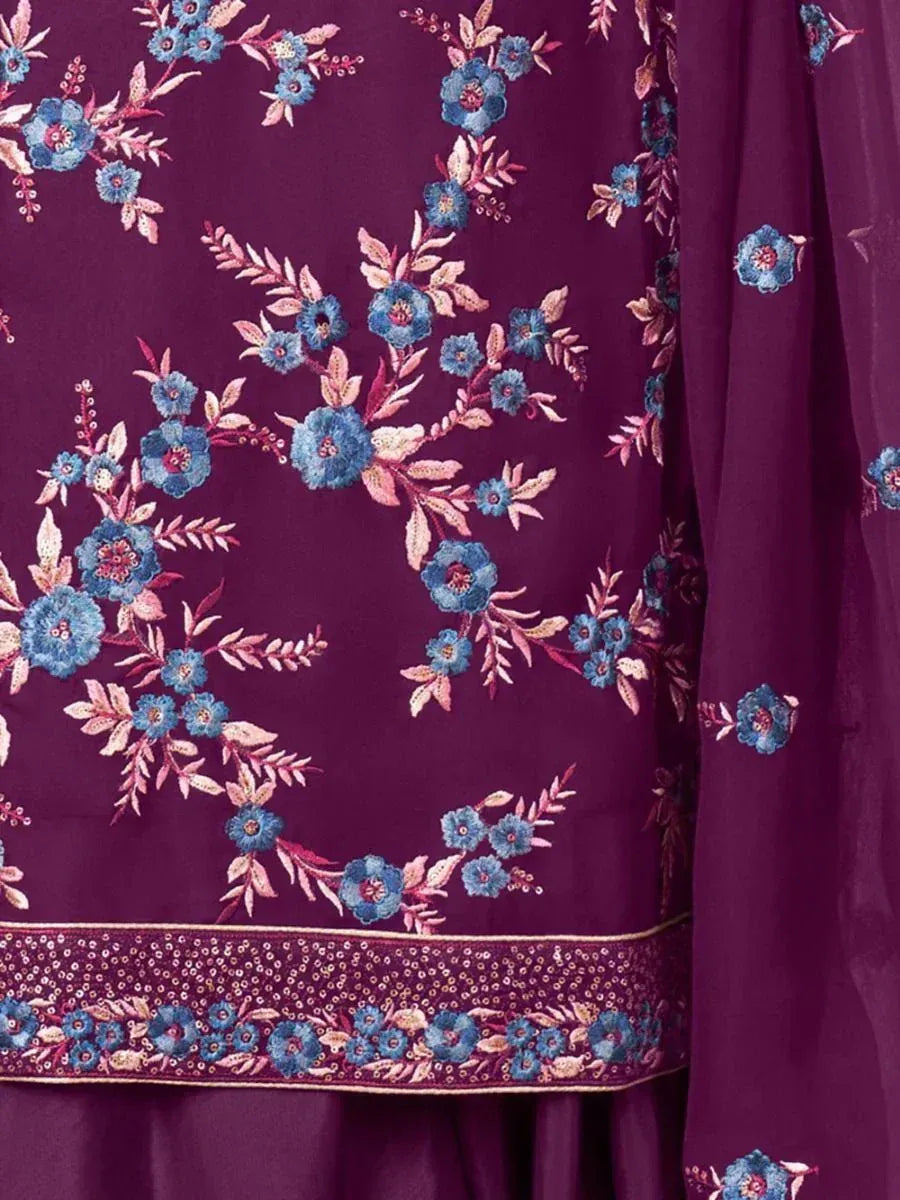 Purple ethnic dress with intricate blue floral embroidery and sequin border detailing