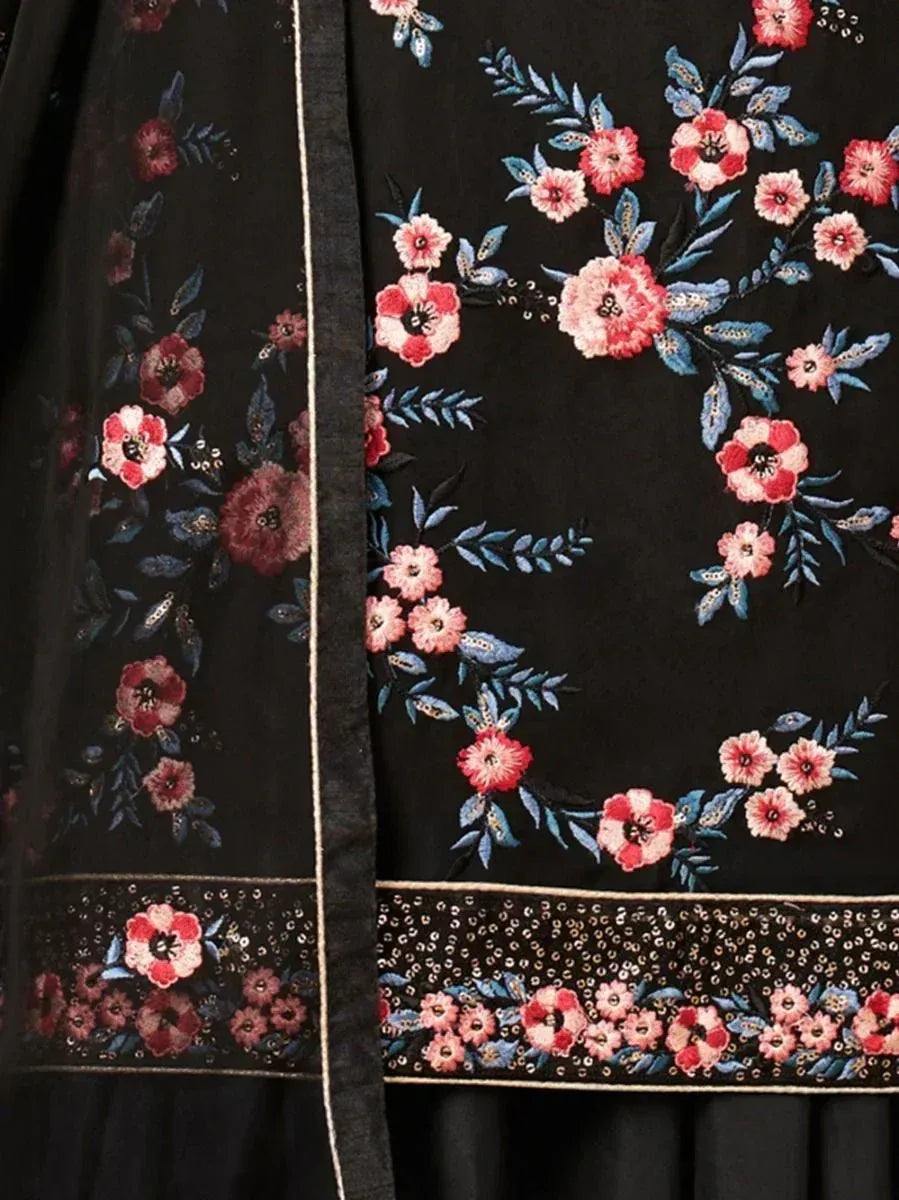 Black ethnic wear fabric with intricate pink floral embroidery and sequin border