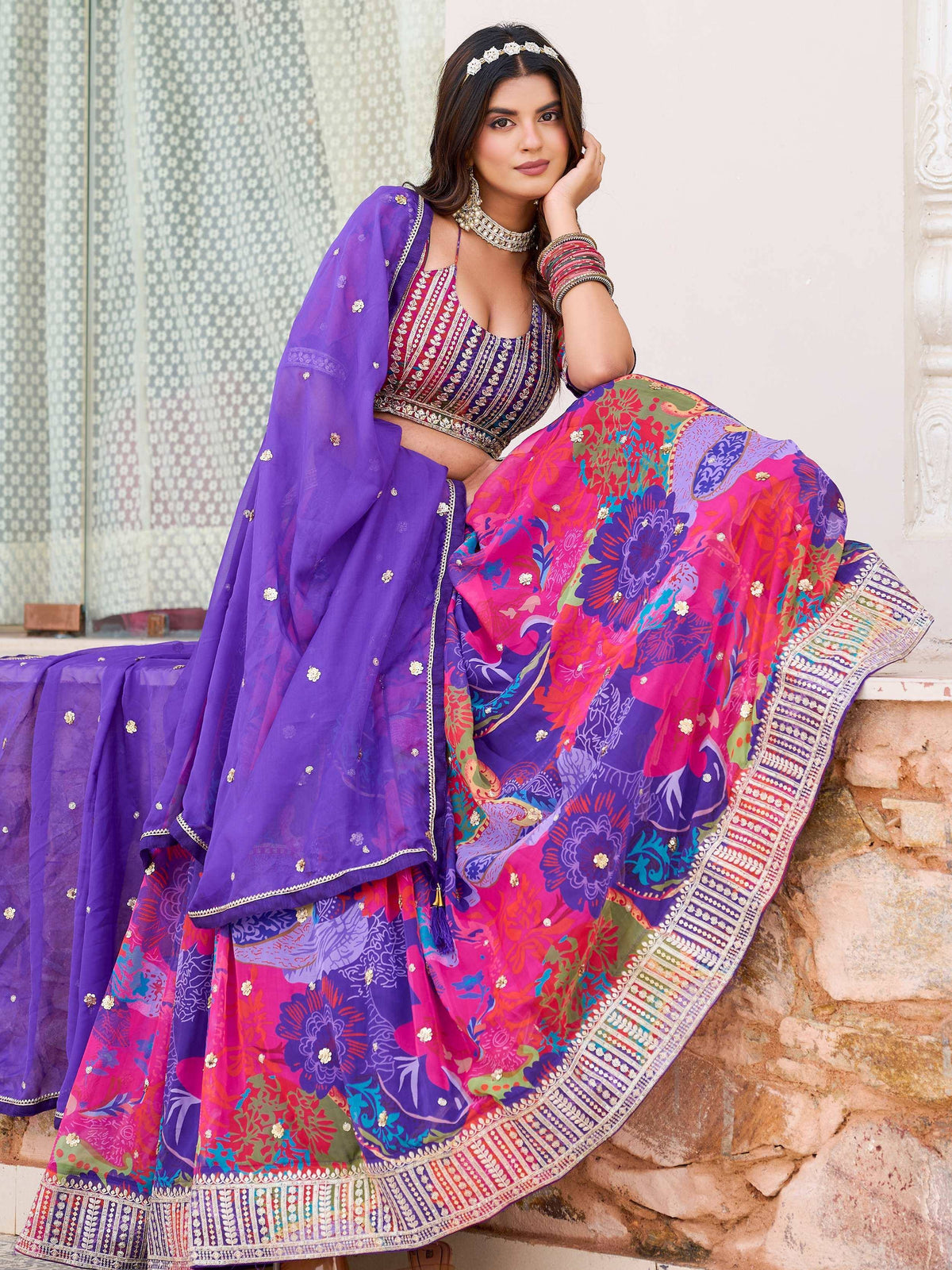 Vibrant floral lehenga choli with purple dupatta, perfect for Indian ethnic wear and festive occasions.
