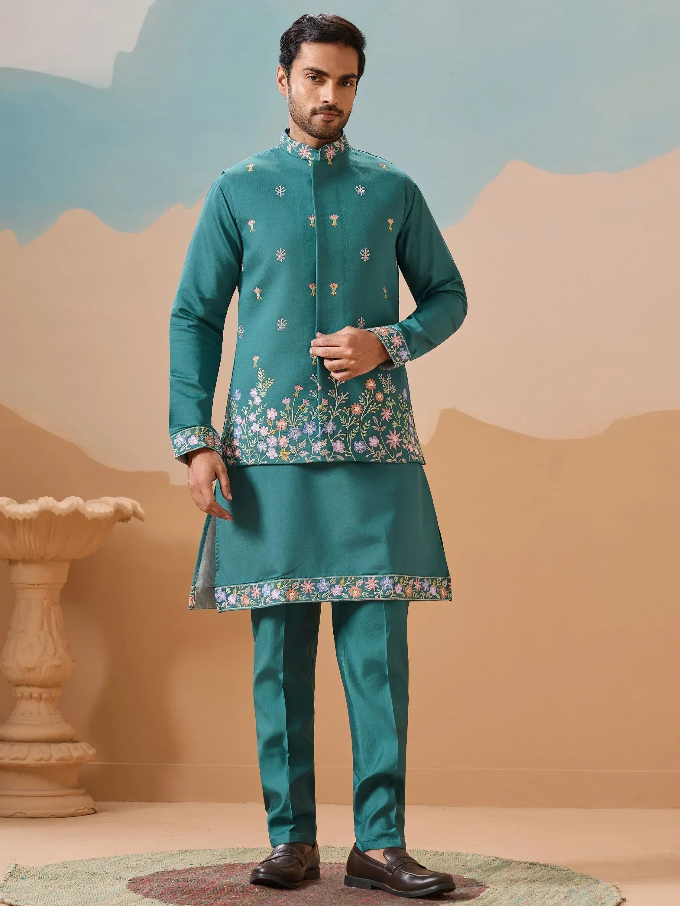 Teal embroidered kurta pajama set with floral motifs, perfect for Indian ethnic wear occasions