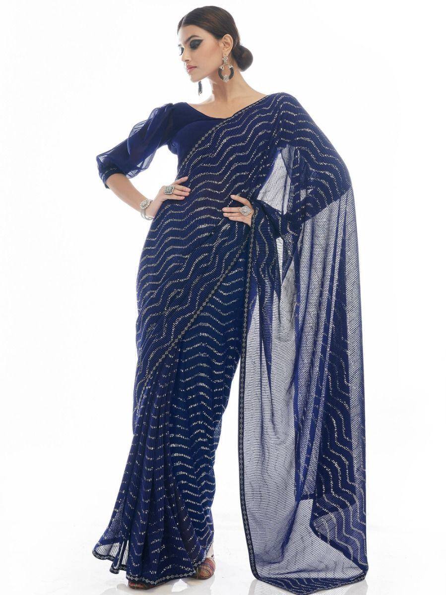 Navy blue designer saree with shimmering zigzag embroidery and sheer pallu, perfect for ethnic occasions